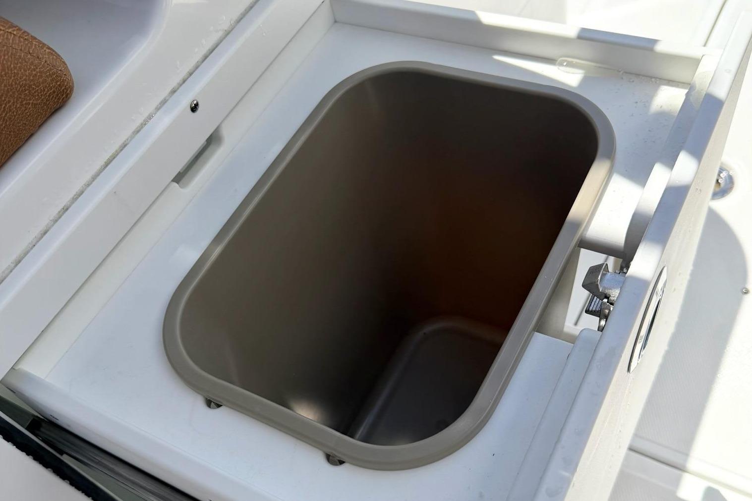 Sea Hunt Ultra 305 Coffin Box 2026 with open storage compartment.