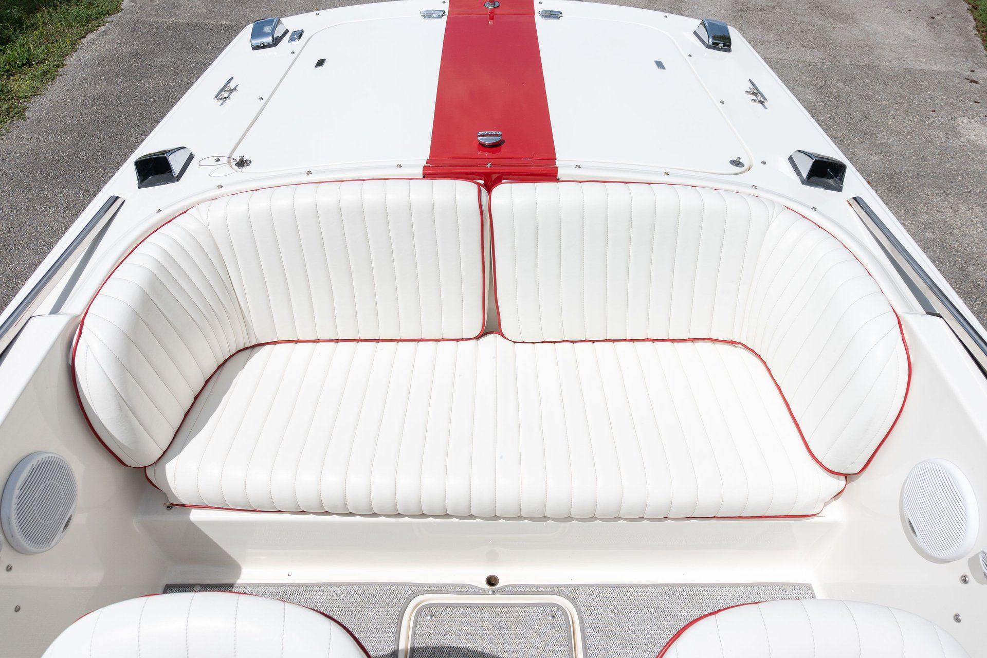 The image shows the cockpit of a 1995 Donzi Classic with white upholstery and red accents.