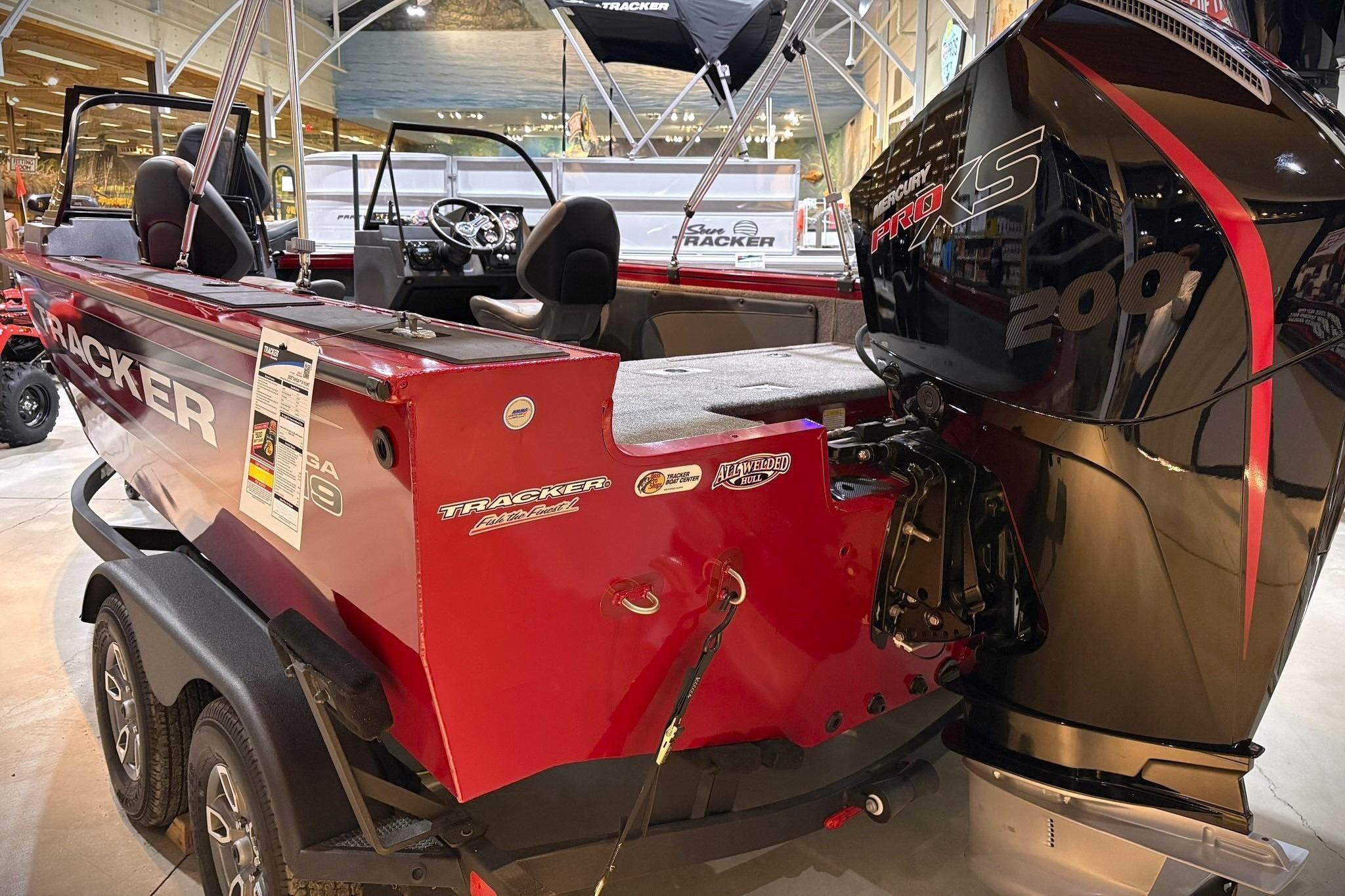 2025 Tracker Targa V-19 WT boat with Mercury Pro XS 200 engine in showroom.