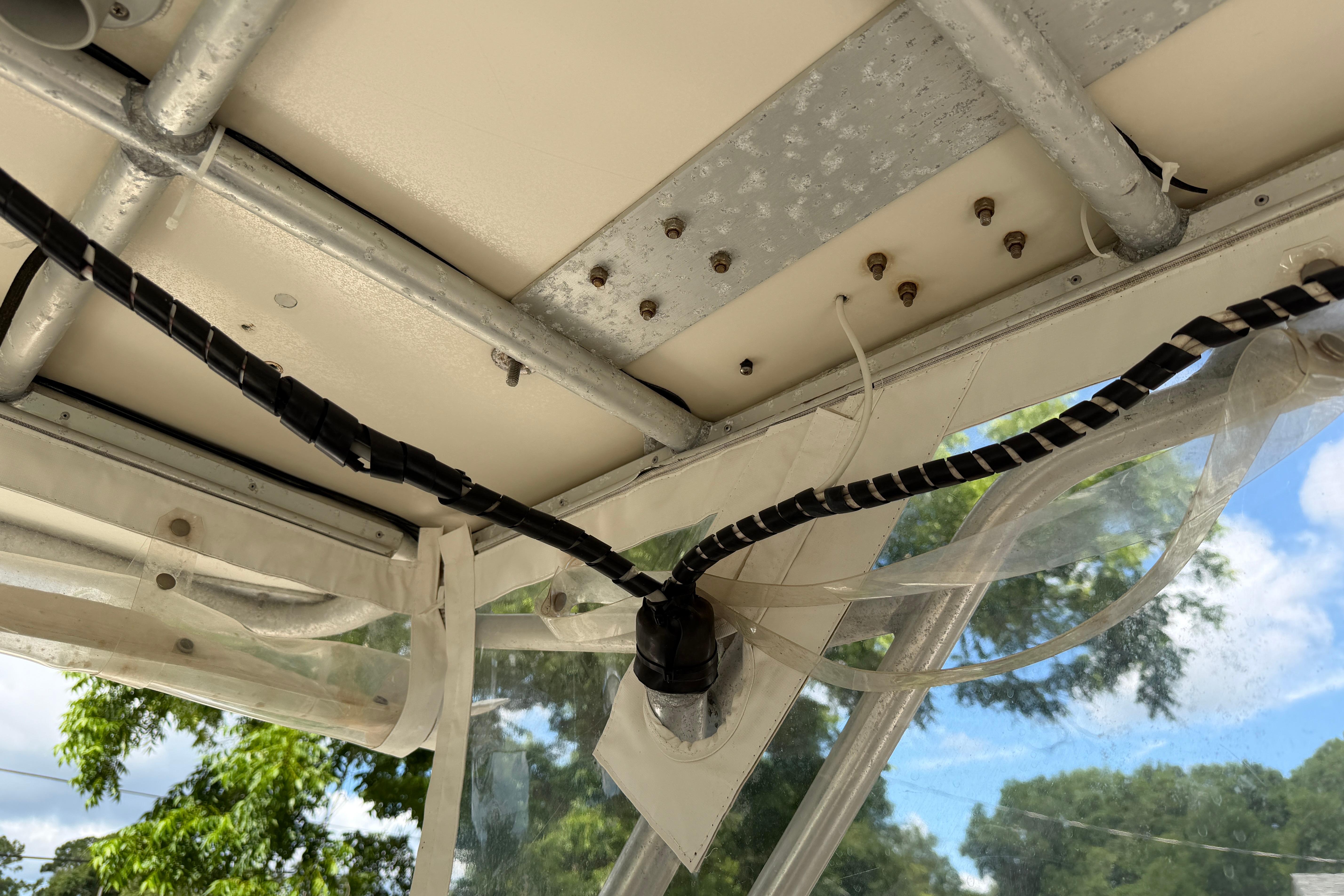 Interior view of a 1987 Grady-White Seafarer 226 boat, showing wiring and metal framework.