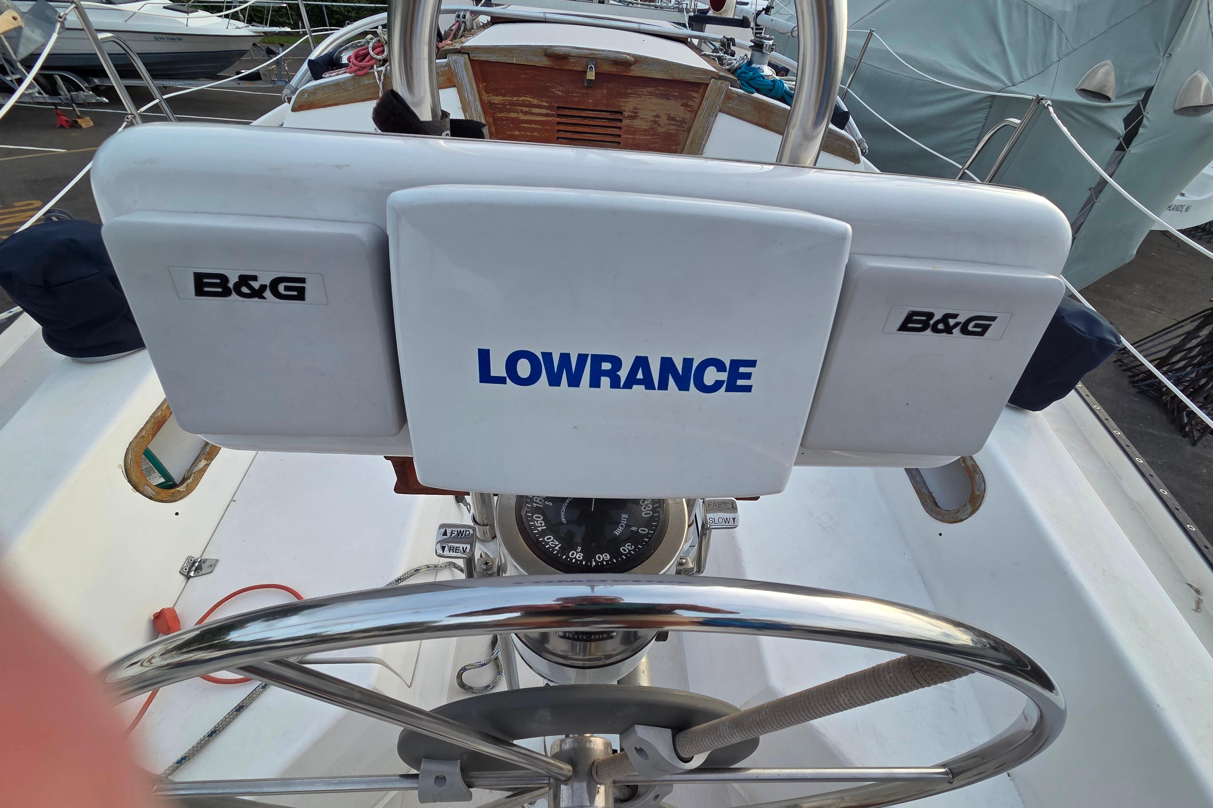Steering wheel and navigation equipment on a 1986 Catalina 355 sailboat.