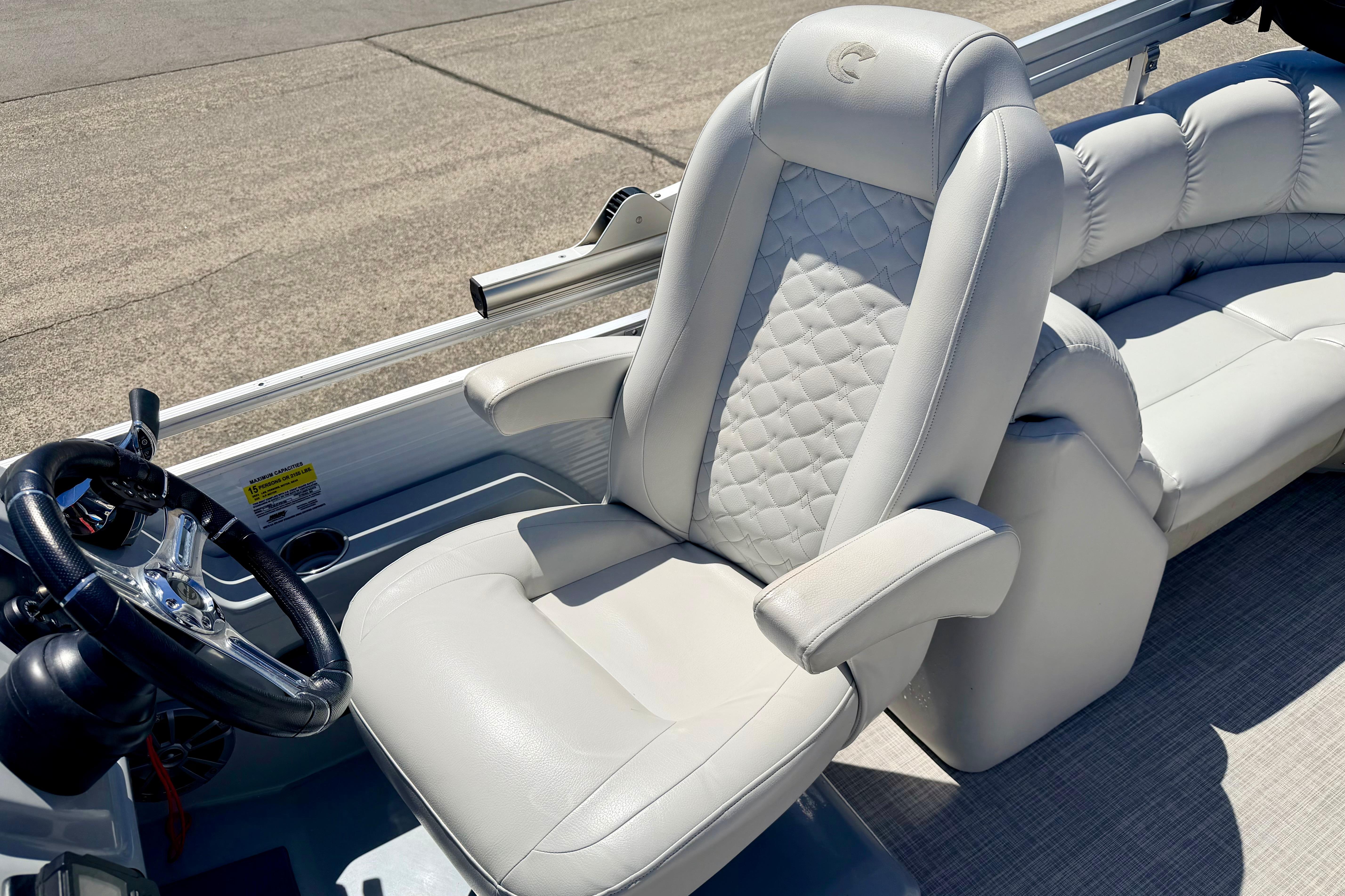 2019 Crestliner 240 Rally DX CW boat interior with plush seating and steering wheel.