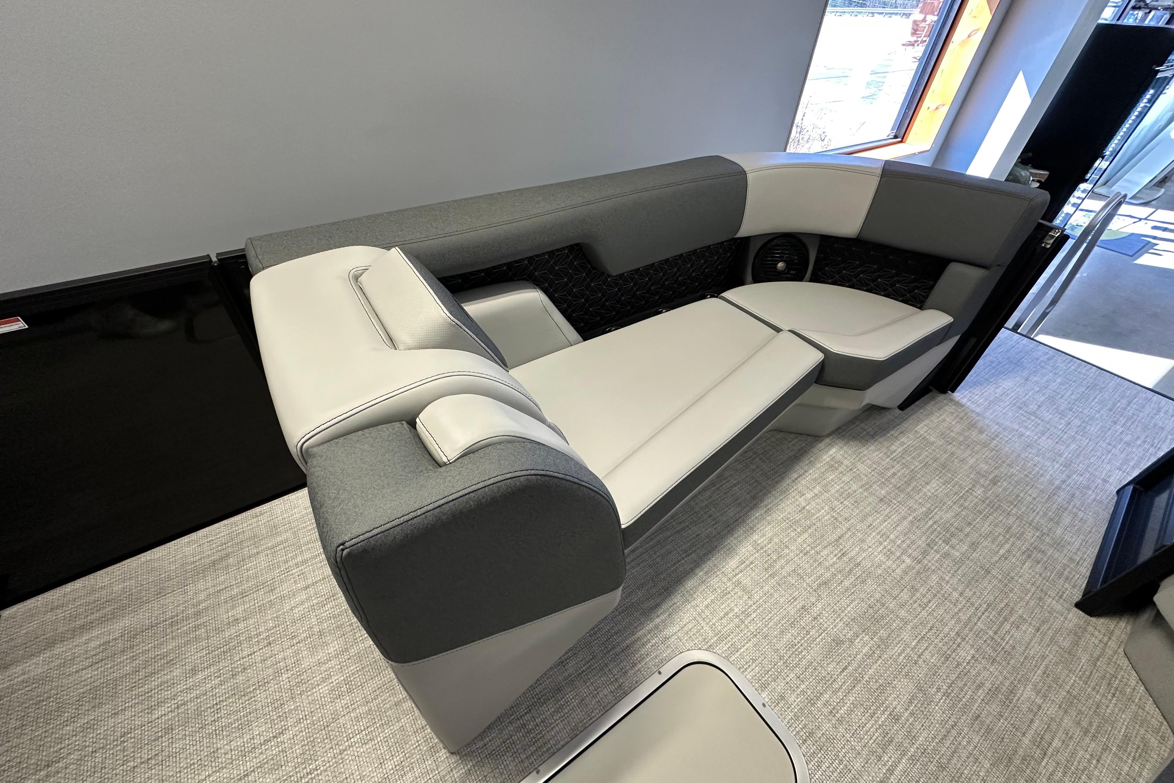 Modern Alera M25L 2026 boat interior with sleek gray and white seating.
