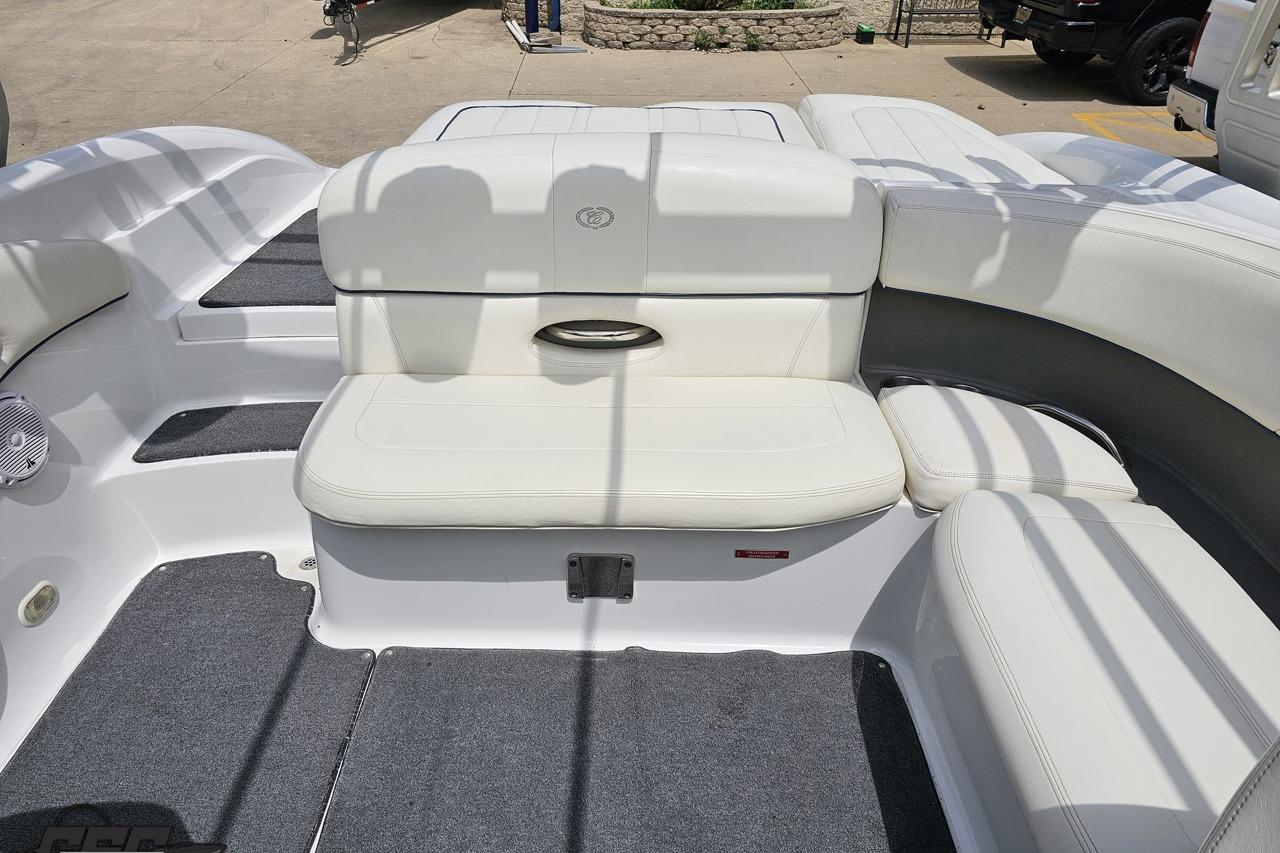 2010 Cobalt 232 WSS boat interior with white seating and gray carpet.