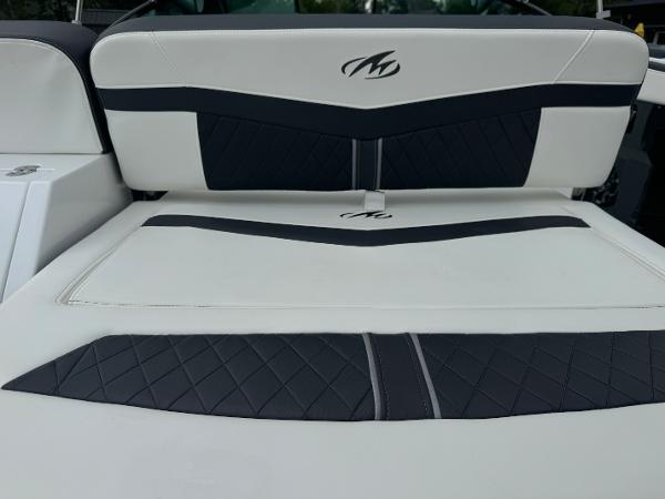 2018 Monterey 258 Super Sport boat interior with black and white cushioned seating.