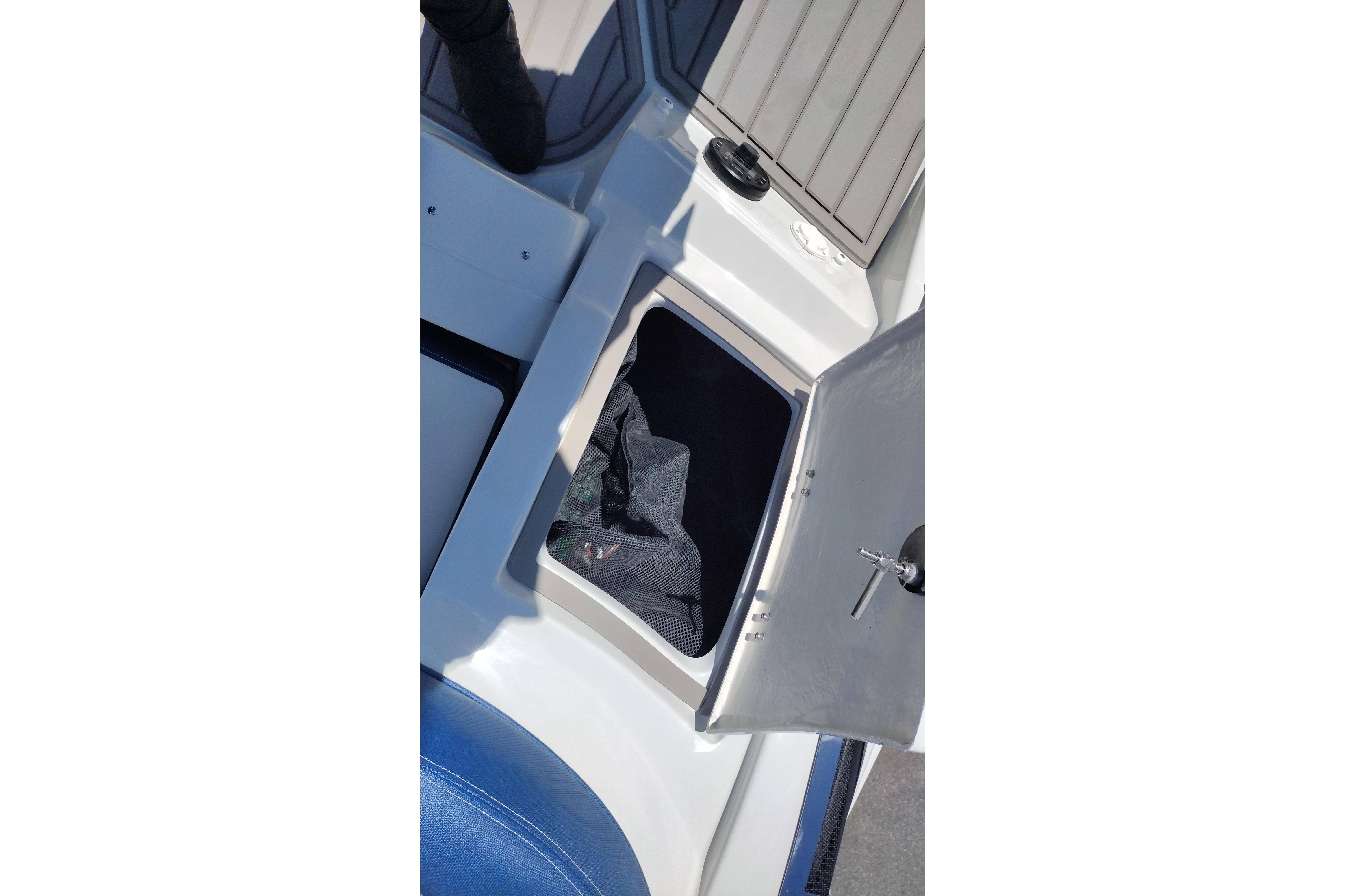 Open storage compartment on 2026 Crownline 260 XSS boat deck.