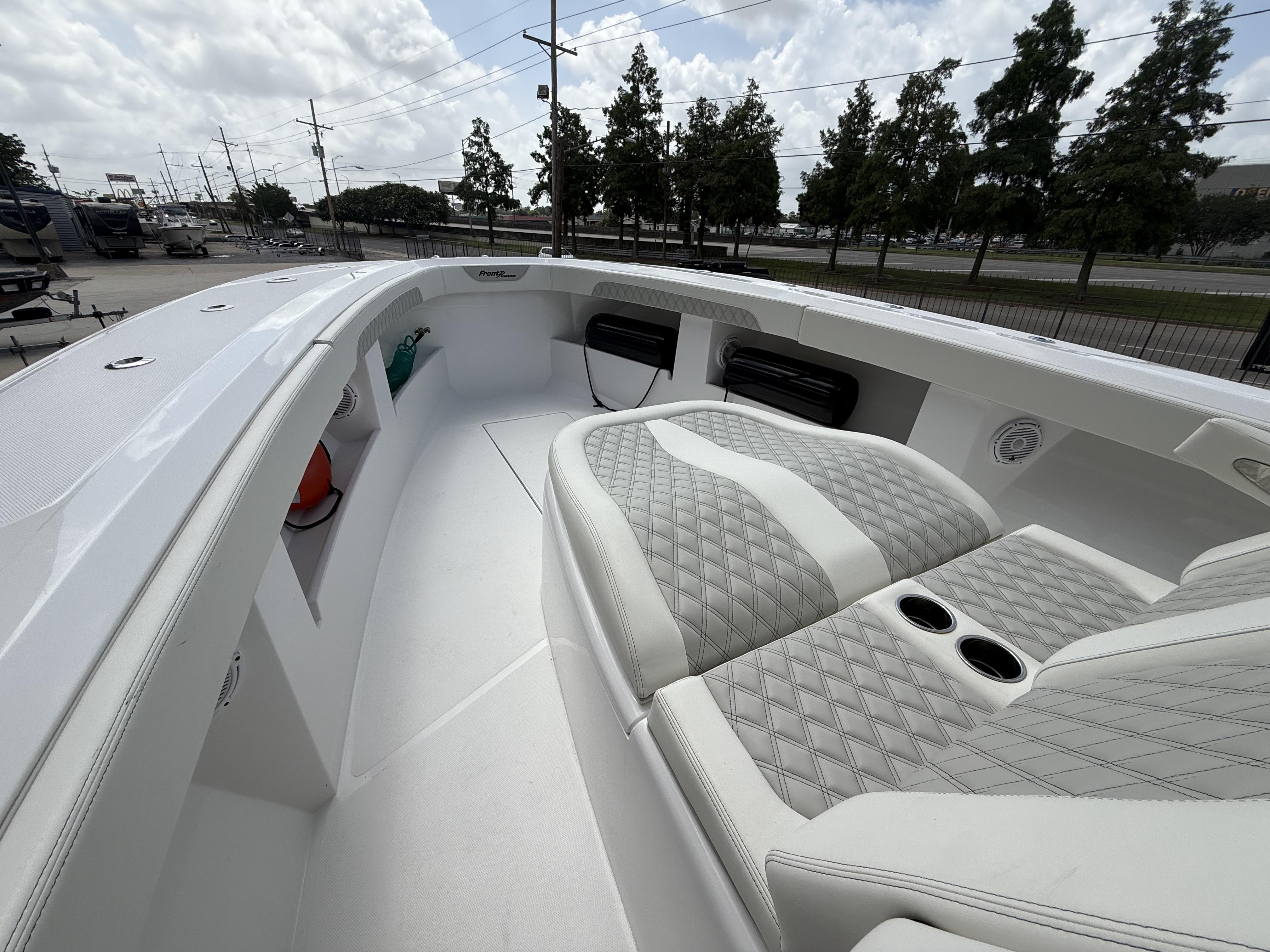 2024 Front Runner 39 CC boat interior with quilted seating and cup holders.
