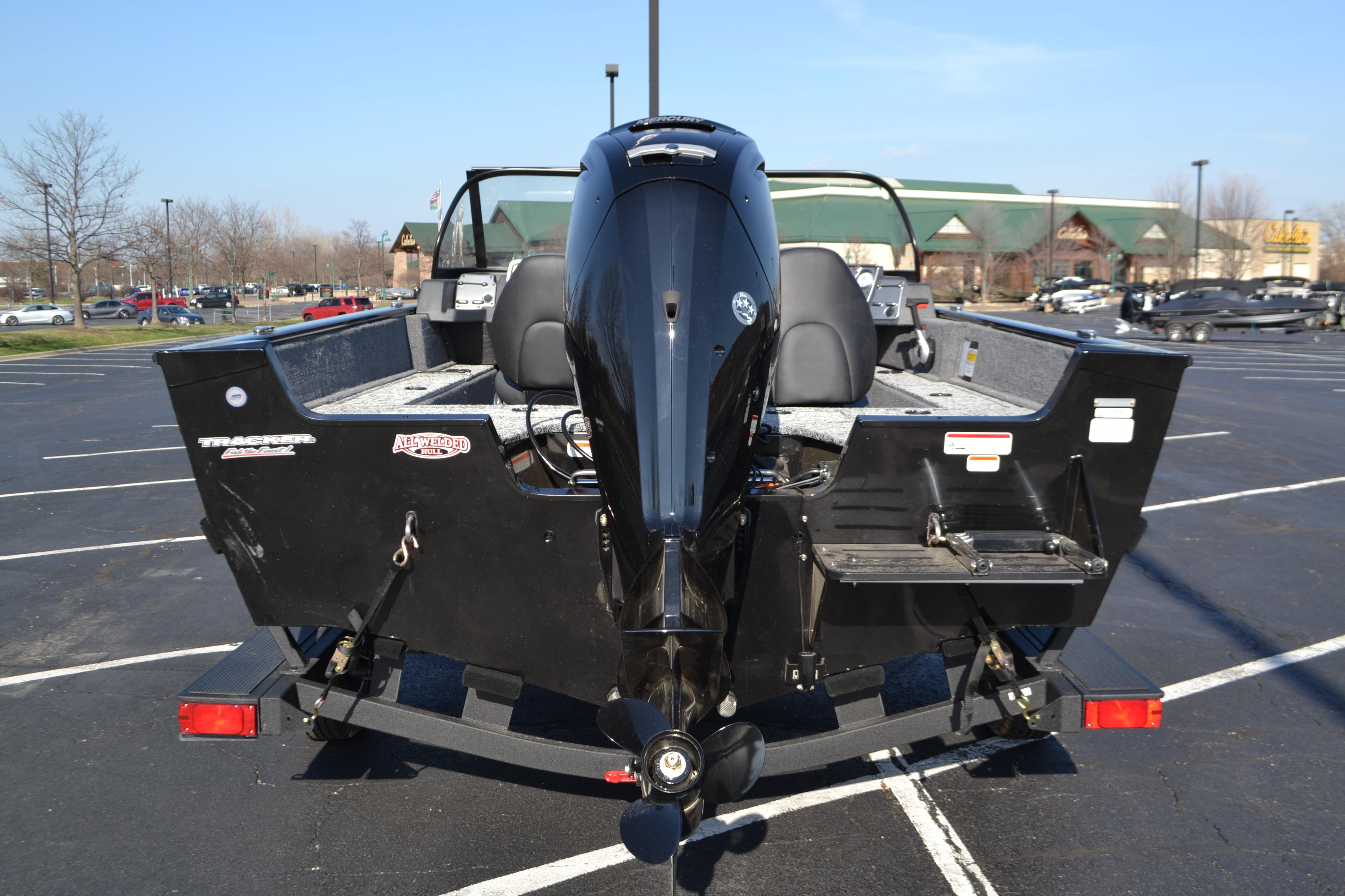 2026 Tracker Pro Guide V-175 WT boat in parking lot, rear view.