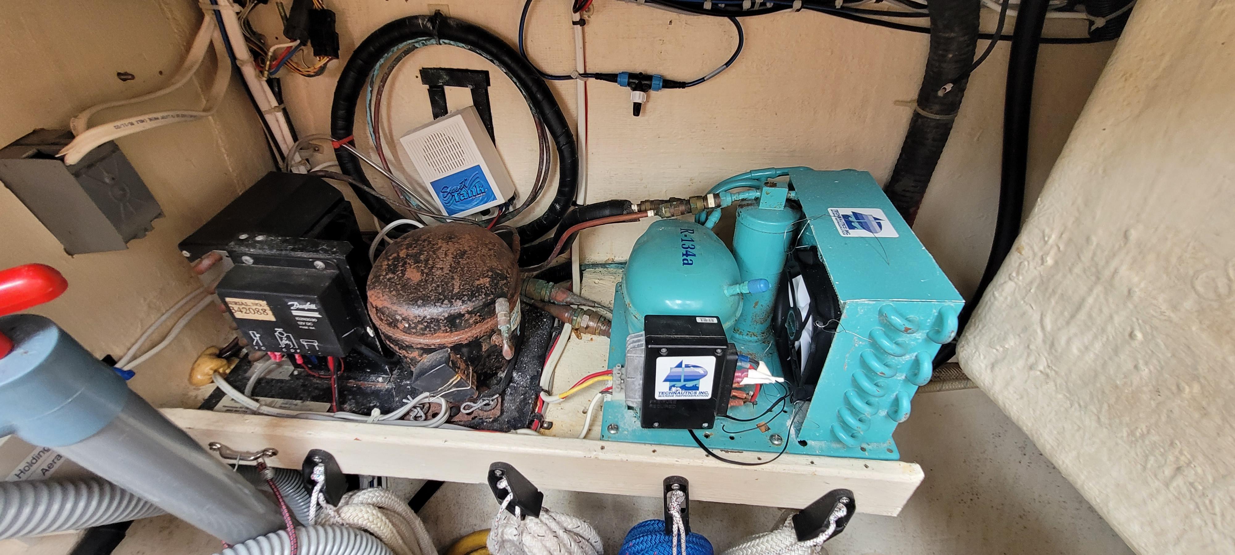Engine room of a 1997 Saga 43 boat, featuring mechanical and electrical components.