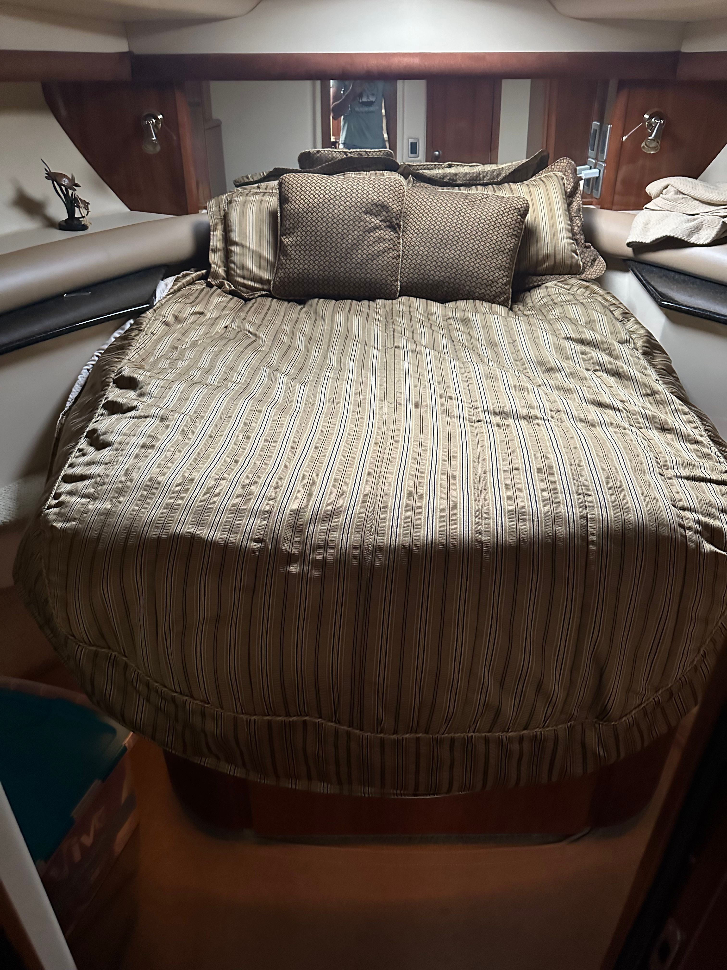 Interior of a 2007 Meridian 459 Motoryacht with cozy bed.
