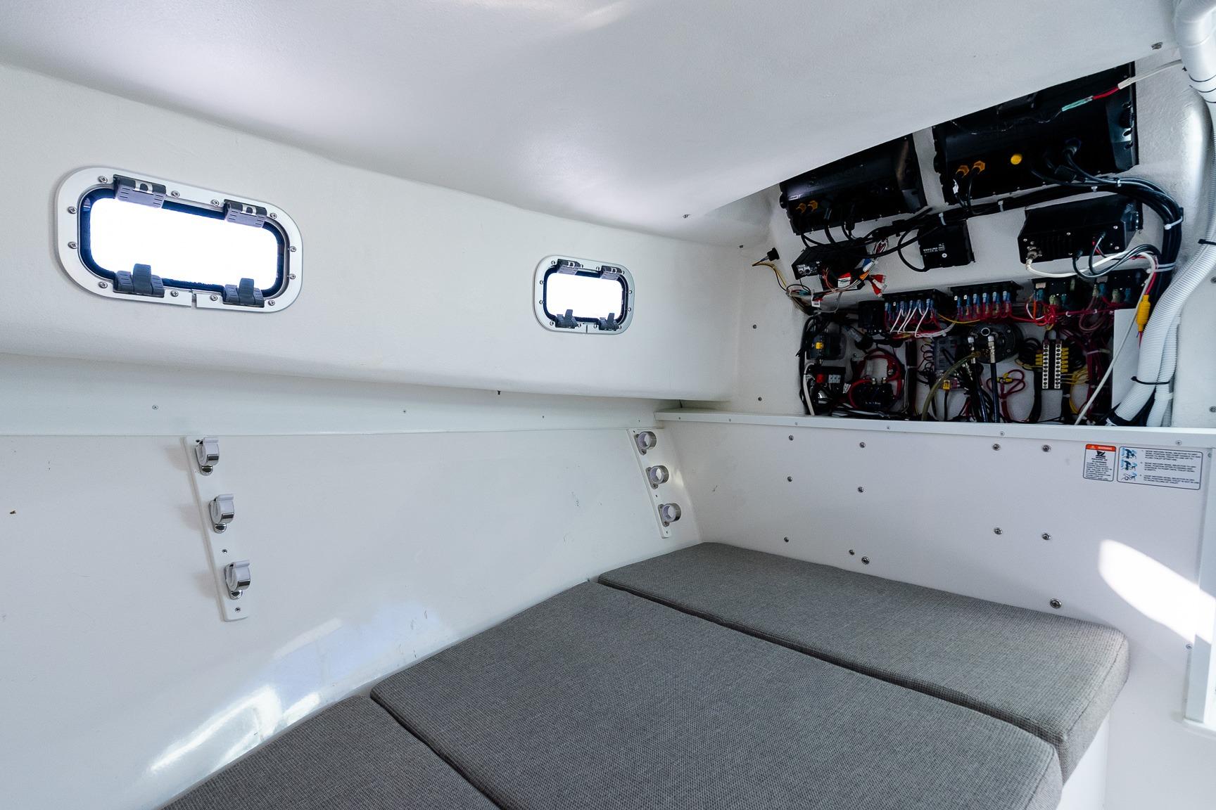 2024 Steiger Craft 31 Fisherman cabin interior with wiring and cushioned seating.