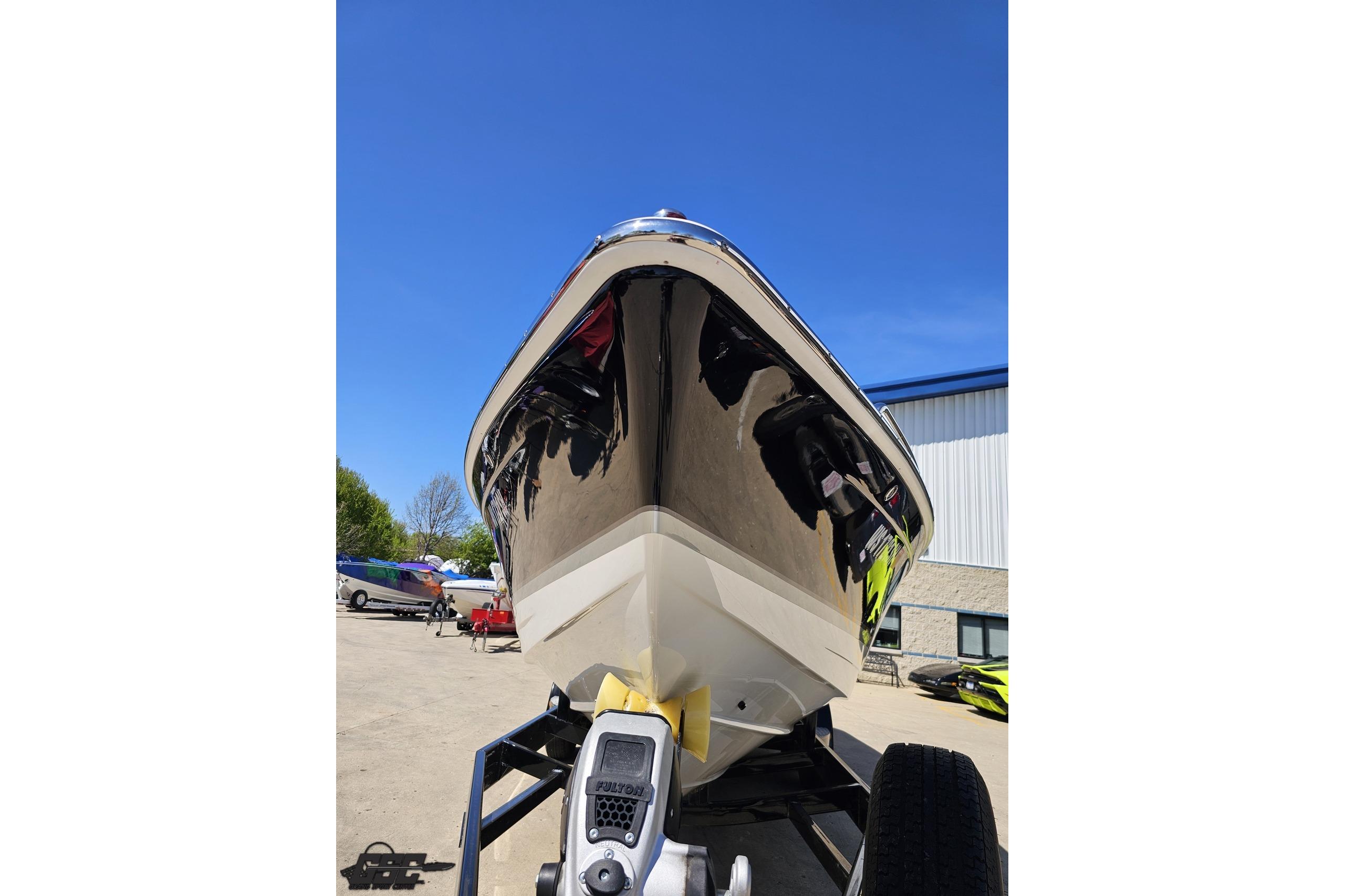 2014 Formula 292 FASTech boat on trailer, viewed from the front under clear blue sky.