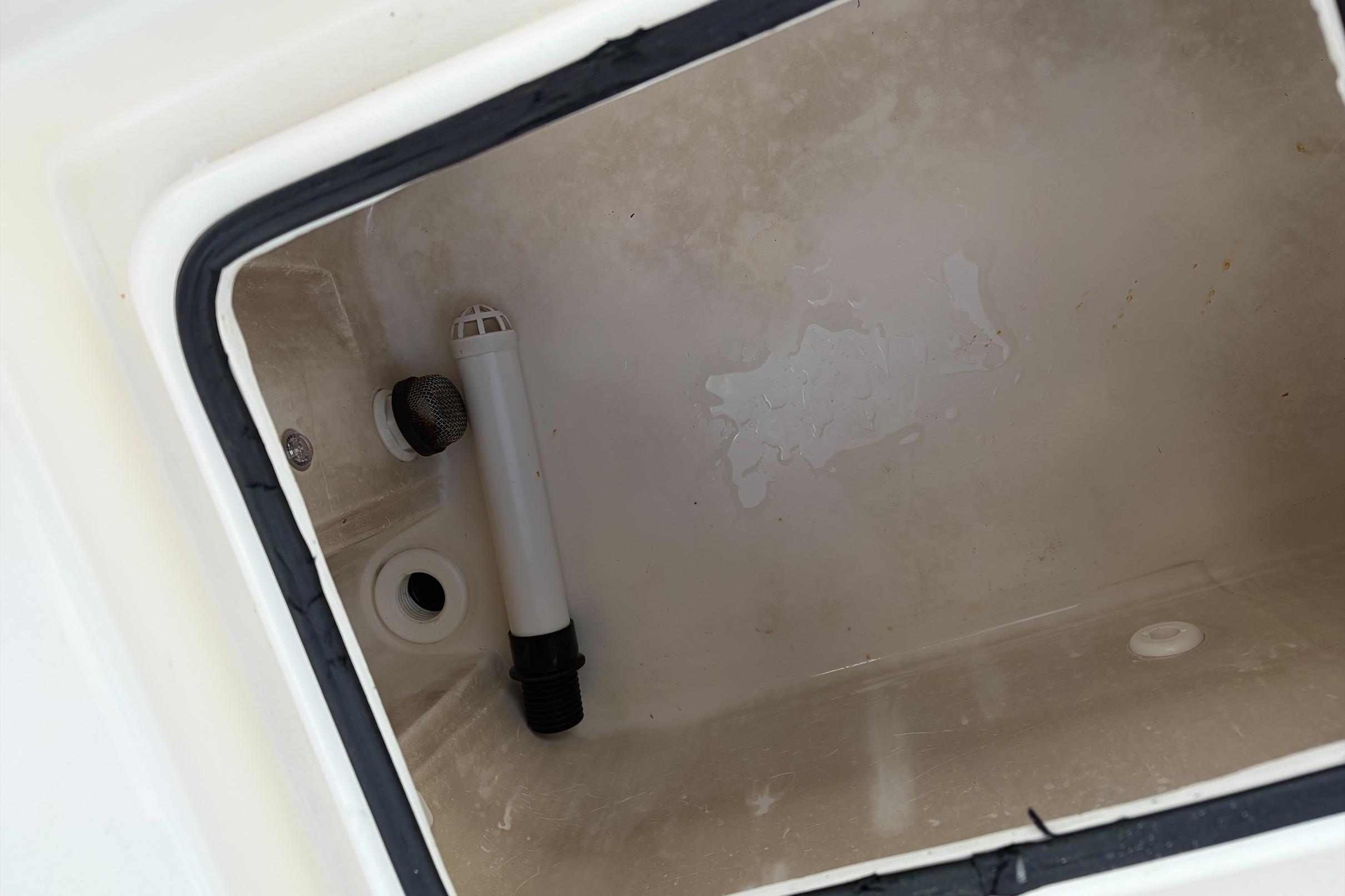 Interior of a 2017 Pathfinder 2200 TRS boat compartment with drainage features.