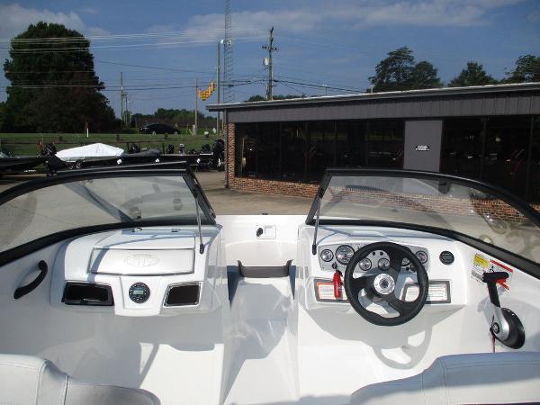 2023 Tahoe 185 S boat cockpit with steering wheel and dashboard controls.