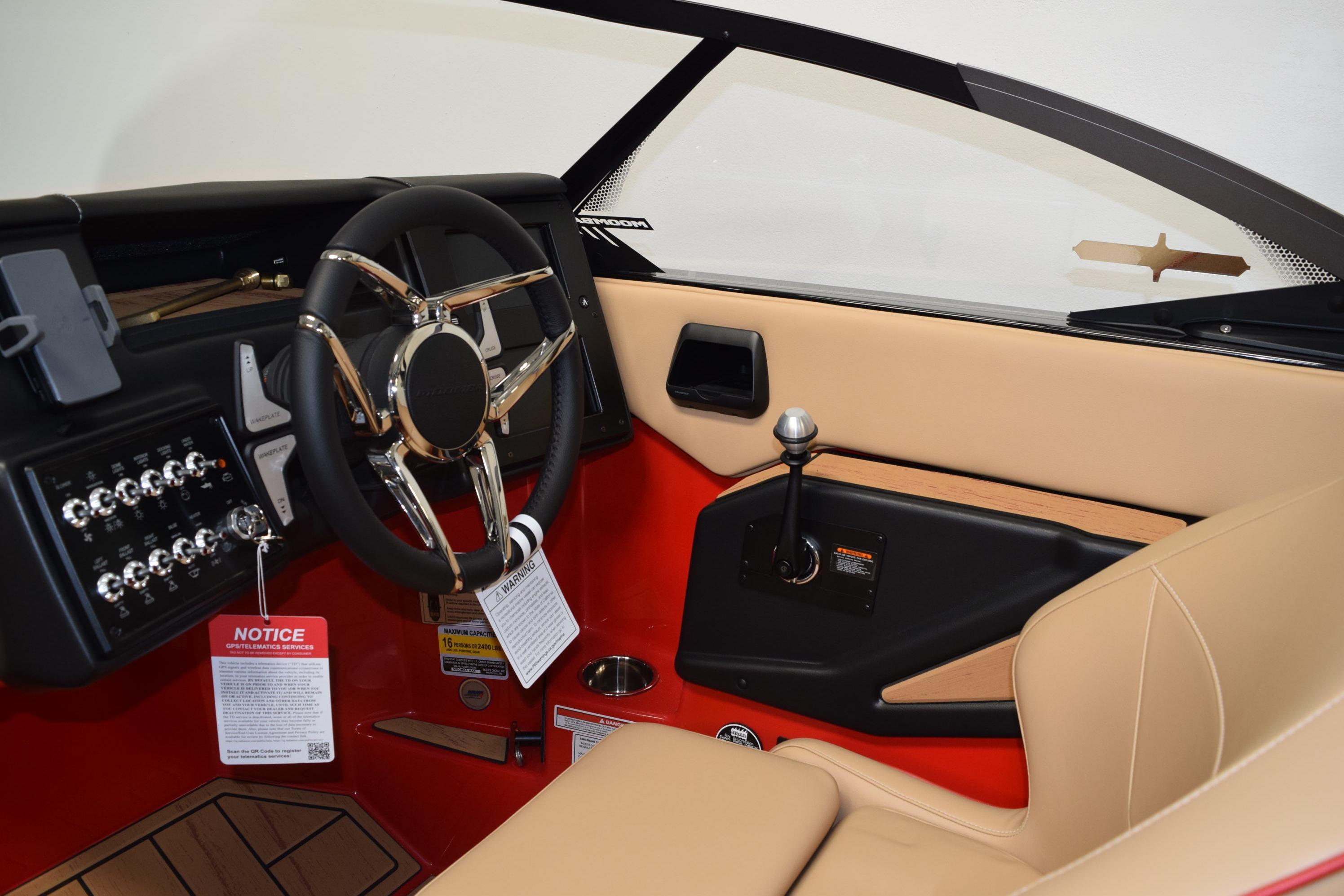 2026 Moomba Max boat interior with sleek steering wheel and modern dashboard controls.