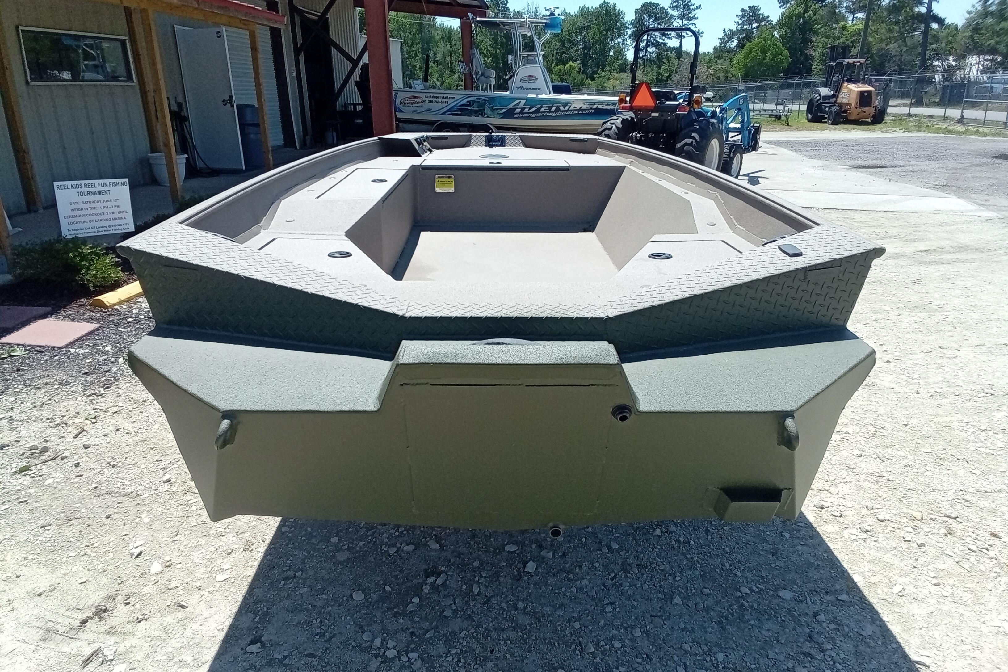 2026 Alweld 1652 Invader boat displayed outdoors, showcasing its sturdy design.