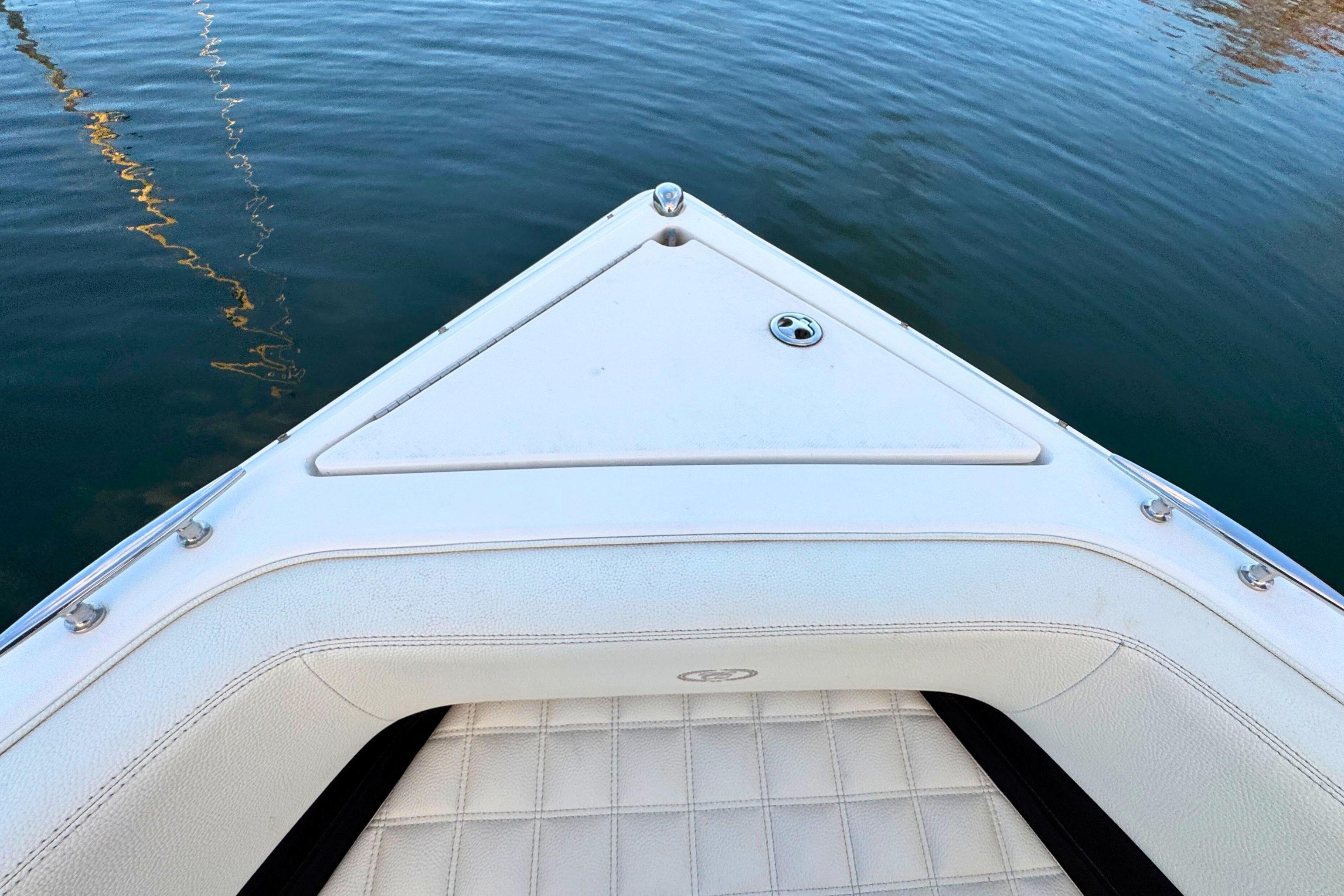 Bow of a 2019 Cobalt R3 boat on calm water.