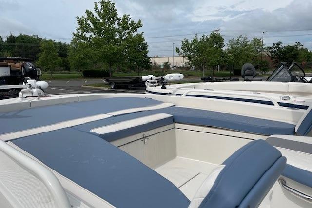 2025 Ranger 2360 Bay boat with blue upholstery outdoors.