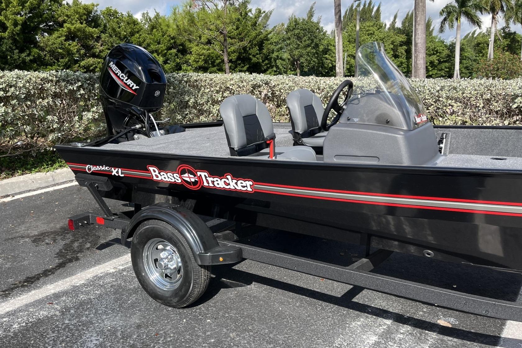 2026 Tracker Bass Tracker Classic XL boat with Mercury engine, parked outdoors.