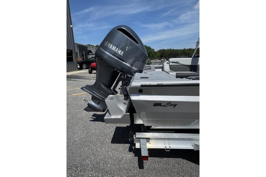 2025 SeaArk Super Lounge Easy boat with Yamaha outboard motor, parked outdoors.
