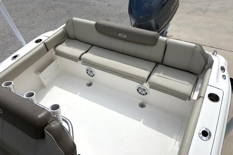 2024 Key West 239 FS boat interior with cushioned seating and cup holders.