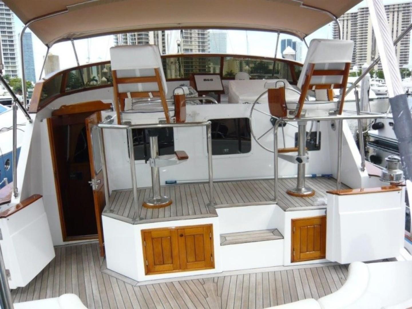 1990 Cheoy Lee Sloop cockpit with dual helm stations and wooden accents.