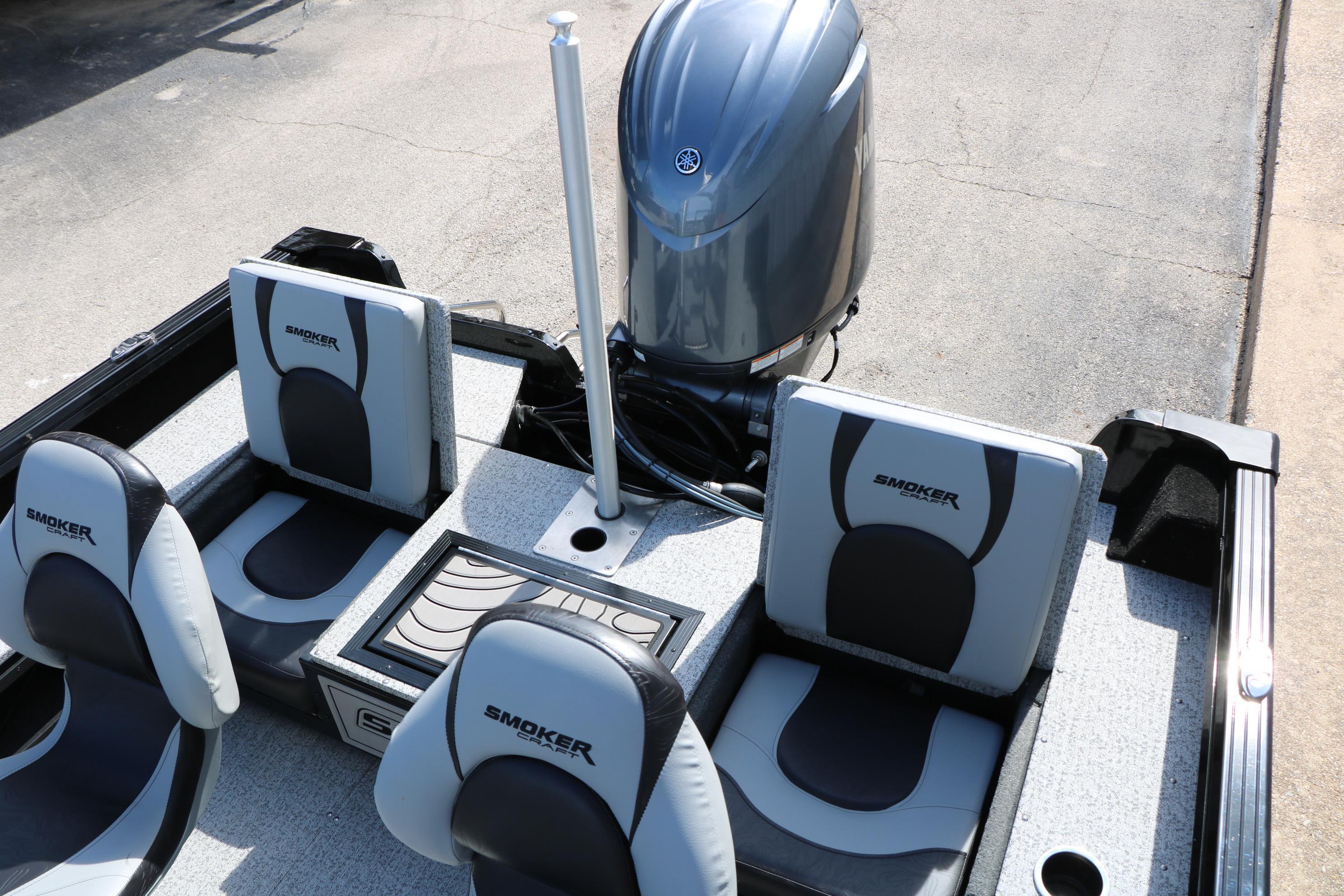 2025 Smoker Craft Adventurer 188 DC boat interior with seating and motor.
