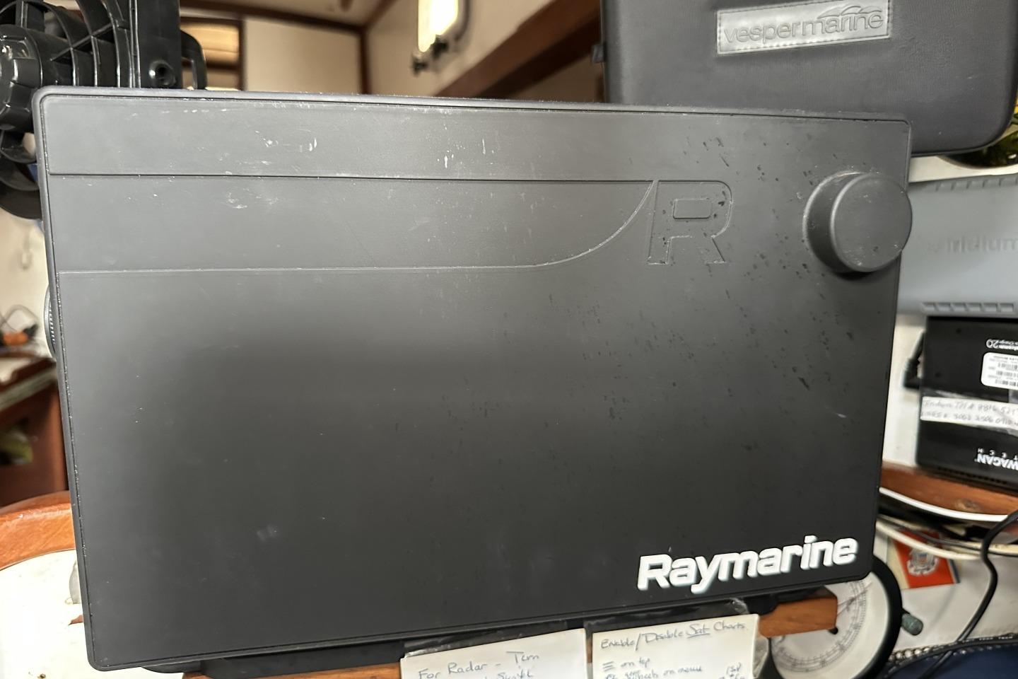 Raymarine navigation equipment on a 1976 Valiant 40 sailboat interior.