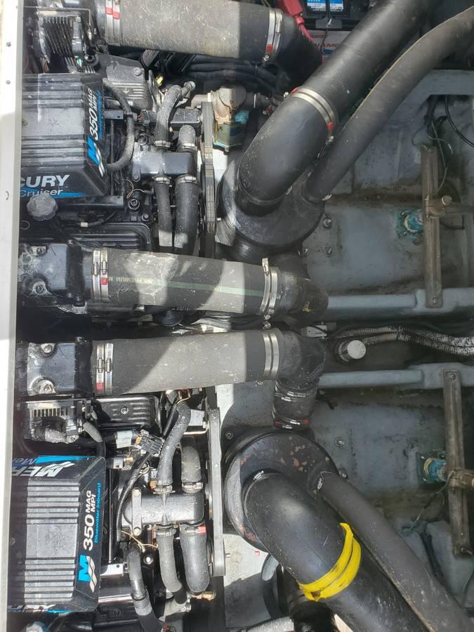 Engine compartment of 2002 Sea Ray 310 Sundancer with Mercury 350 engines.