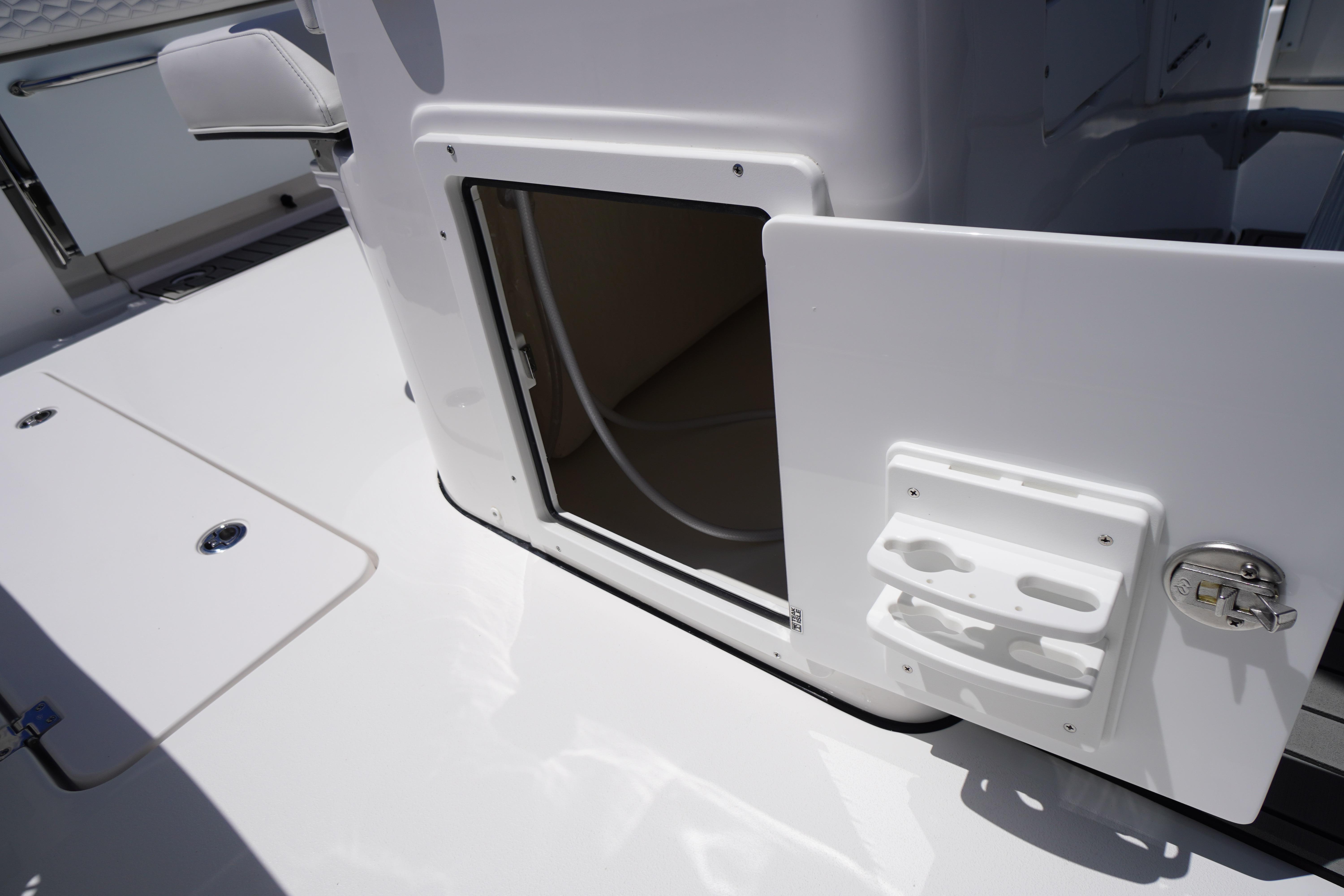 2026 Tidewater 302 CC Adventure boat storage compartment with open hatch and secure latch.
