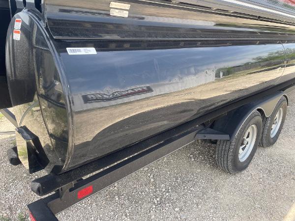 2023 Regency 250 DL3 pontoon boat on trailer, black exterior, dual axle.