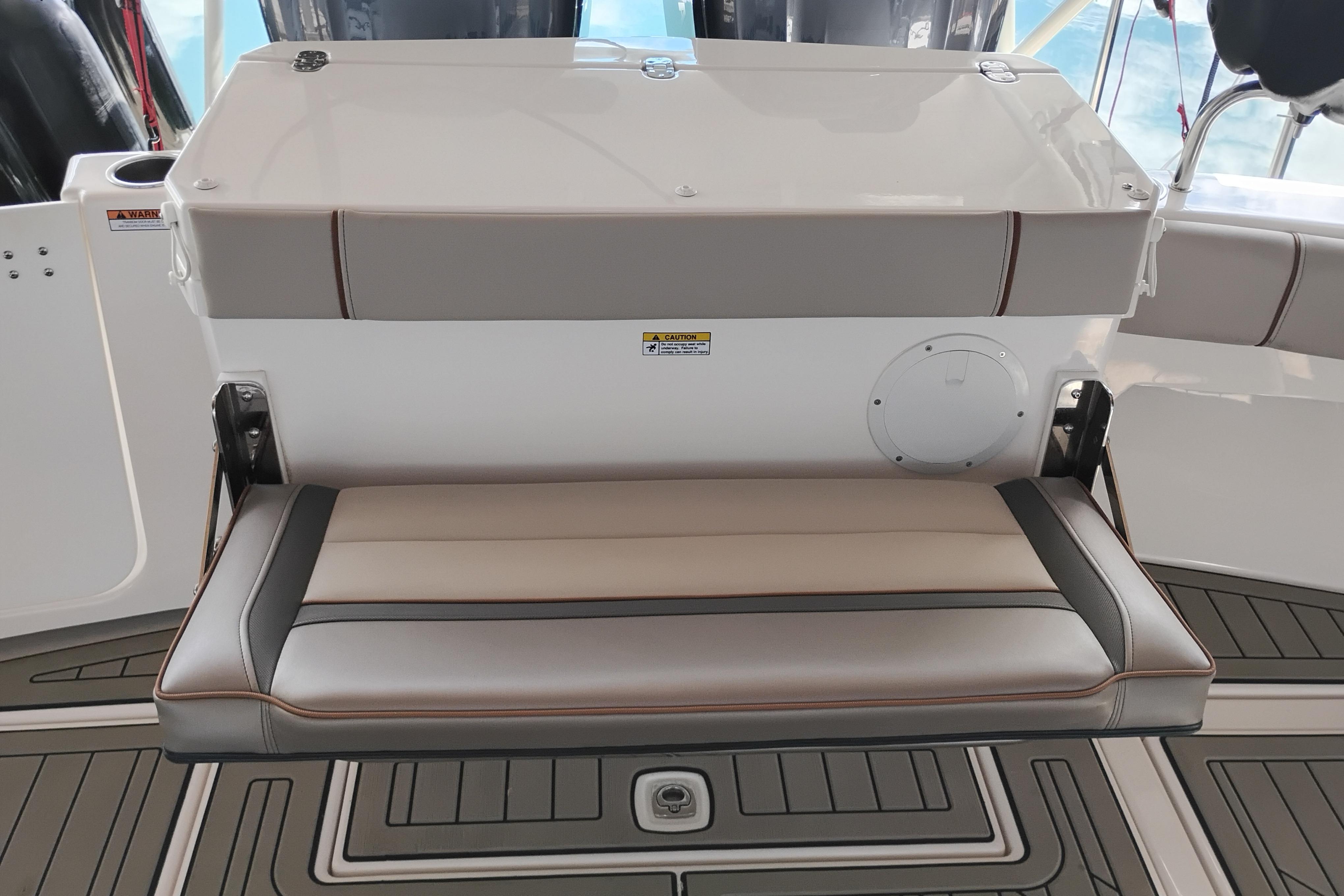 2022 Cutwater C-32 Coupe boat interior with foldable seating and sleek design.