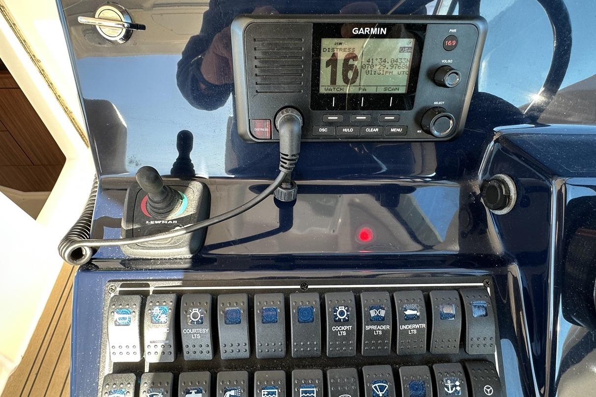 Control panel of a 2016 Pursuit DC 325 Dual Console boat with Garmin display.