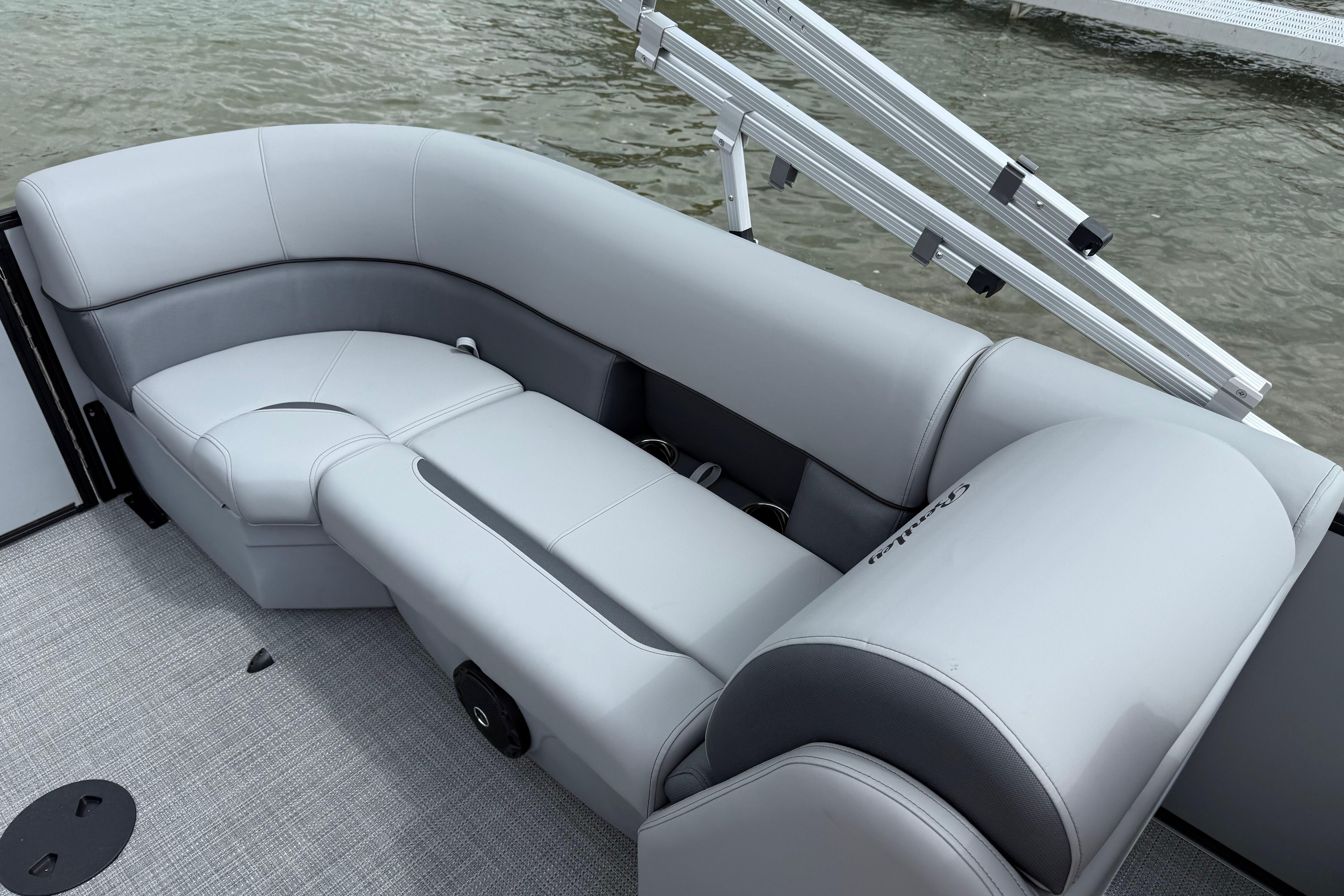 Luxurious seating on 2026 Bentley Pontoons Legacy 220 Navigator, featuring sleek gray upholstery.