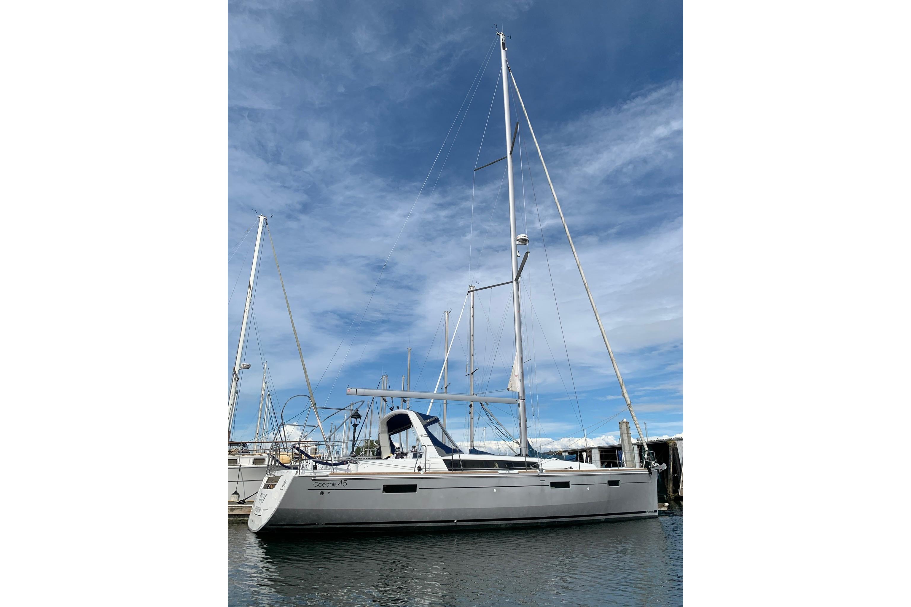 2018 Beneteau Oceanis 45 sailboat docked under a clear blue sky.