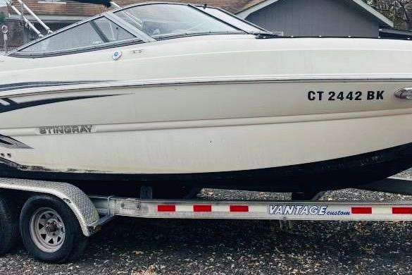 2018 Stingray 214 LR boat on Vantage trailer, side view.