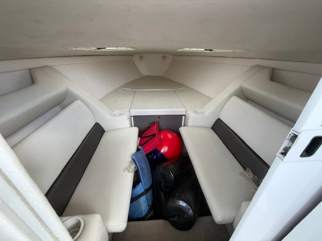 Interior of the 2002 Baja 25 Outlaw with seating and storage space.