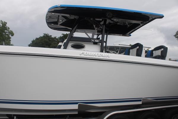 2024 Fountain 34 SC boat with sleek design and blue accents.