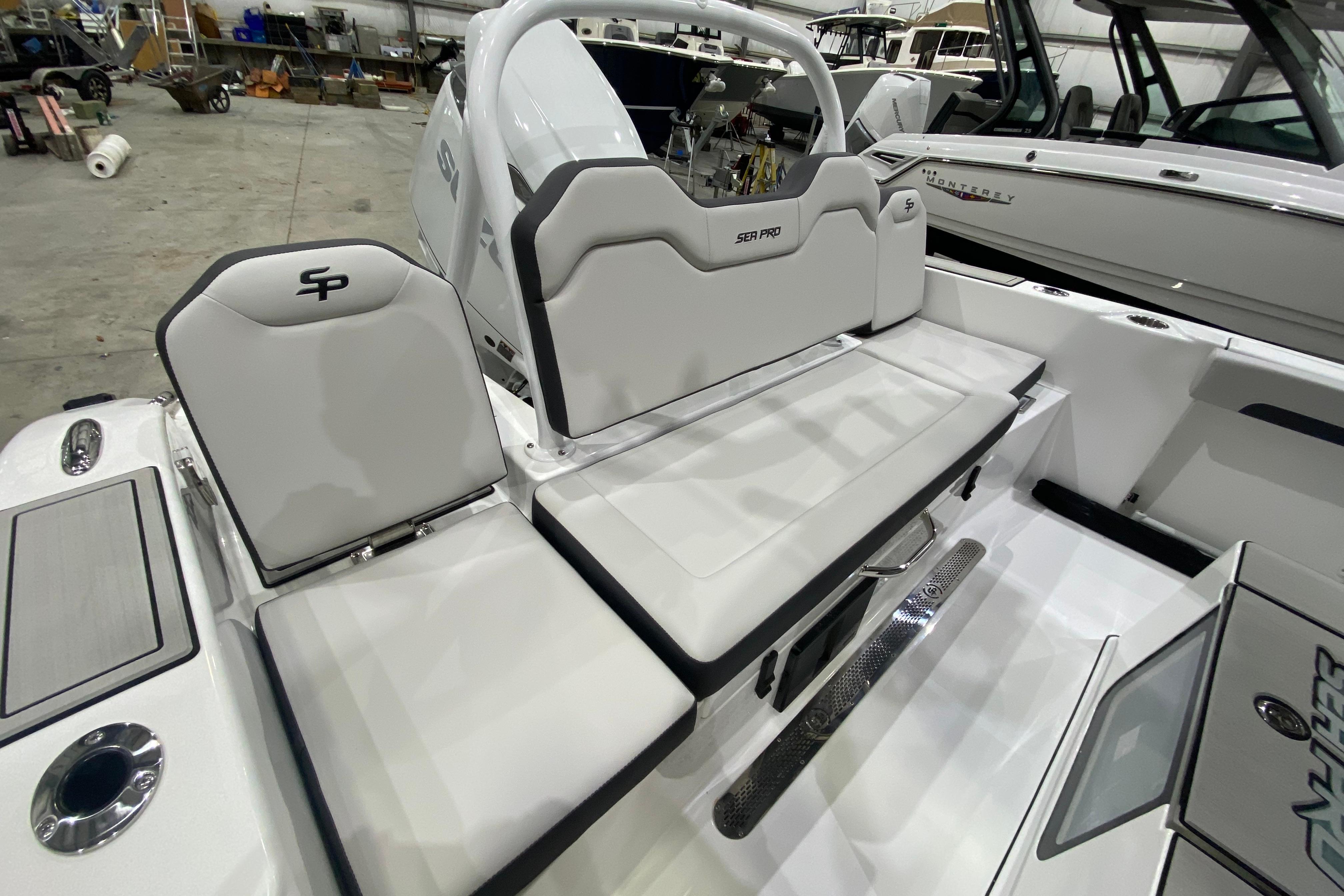 2027 Sea Pro 245FLXR Sandbar boat interior with white seating and sleek design.