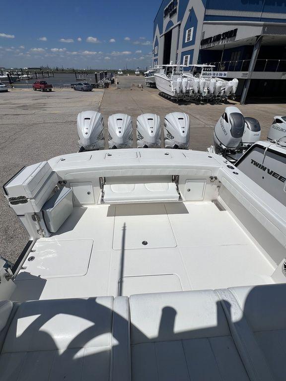 2021 Regulator 41 boat with multiple outboard engines at a marina.