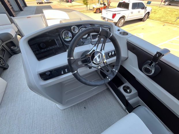Interior view of 2025 Tahoe LTZ QL boat cockpit with steering wheel.