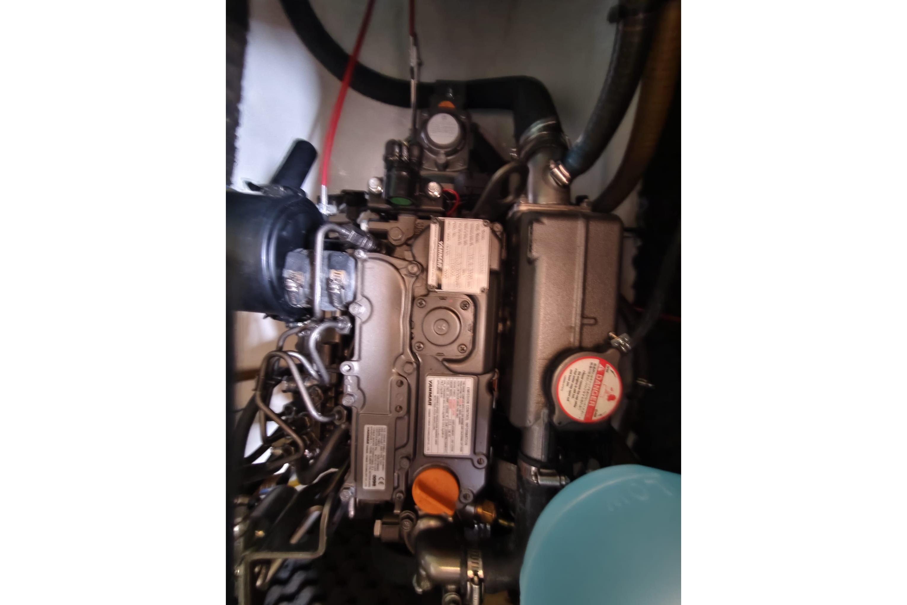 Engine compartment of a 2010 Broadblue 385 catamaran, showcasing mechanical components.