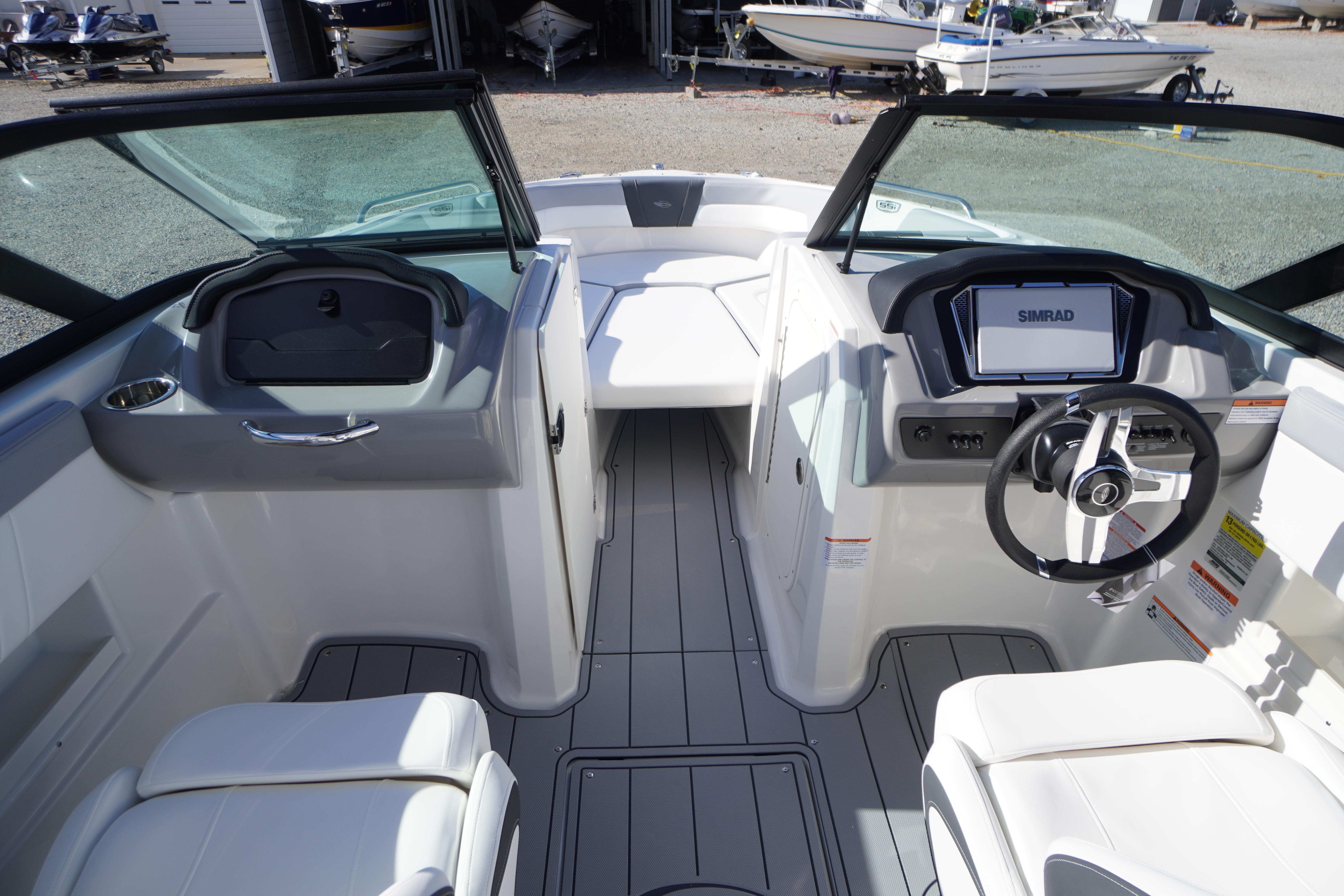 2026 Chaparral 23 SSi OB boat interior with modern dashboard and seating.