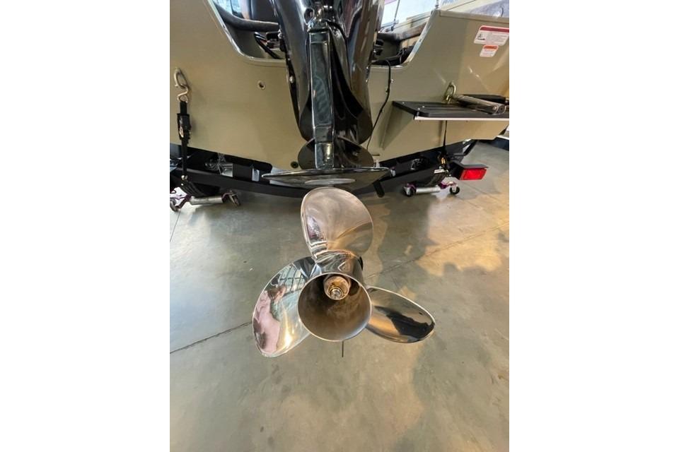 2026 Tracker Targa V-18 WT boat propeller in a showroom setting.