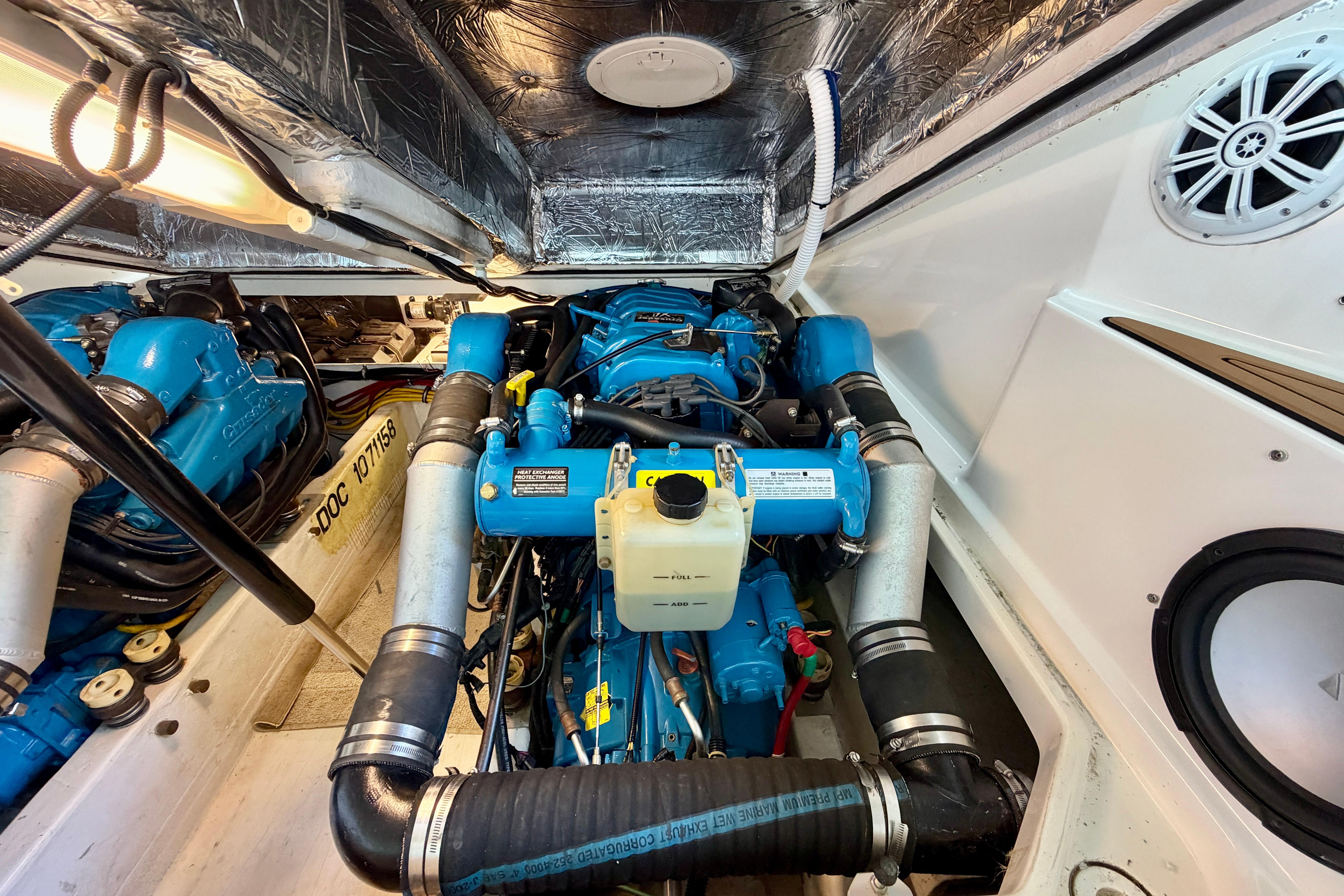 Engine room of a 1999 Tiara Yachts 2900 Coronet with blue engine components.