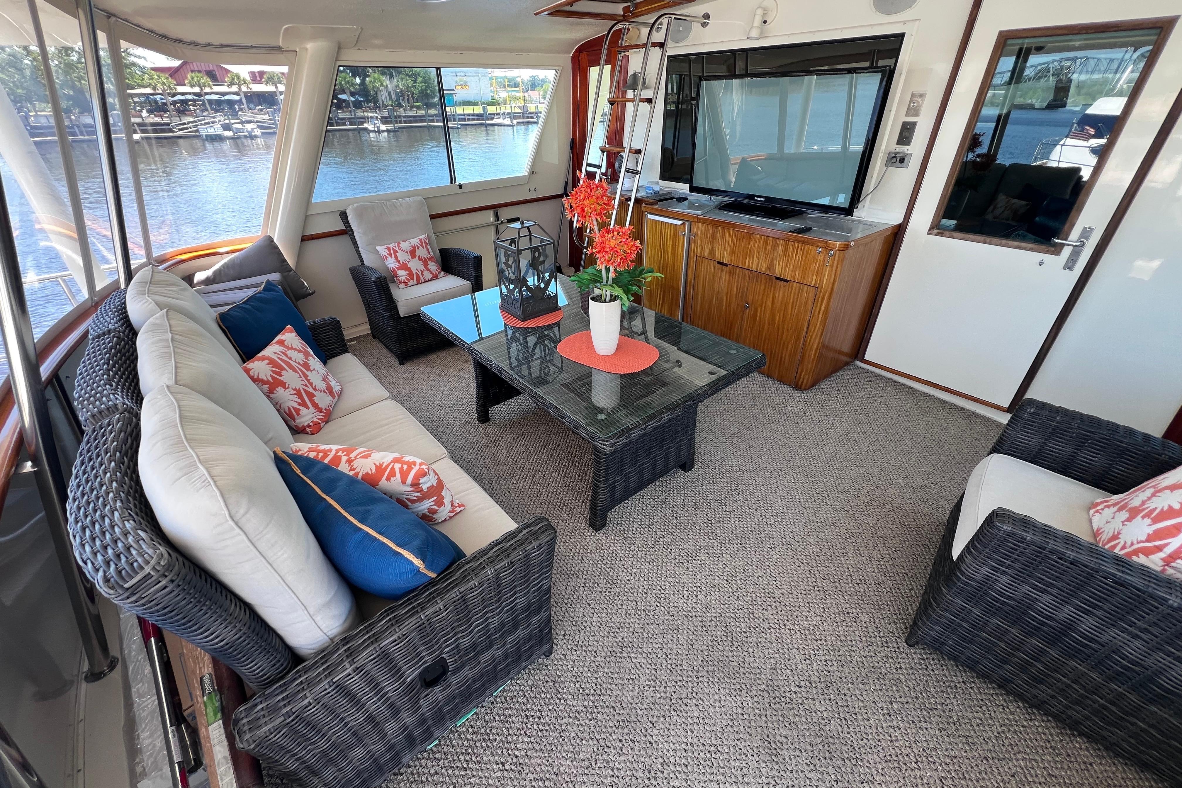 Luxurious interior of 1987 Hatteras 70 Cockpit Motor Yacht with elegant seating and decor.