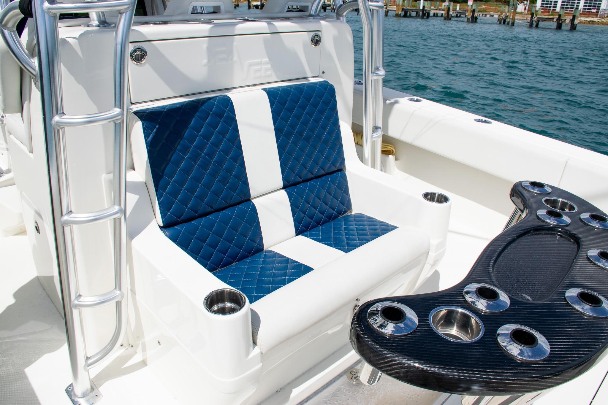 2022 SeaVee 390Z boat interior with blue quilted seating and rod holders.