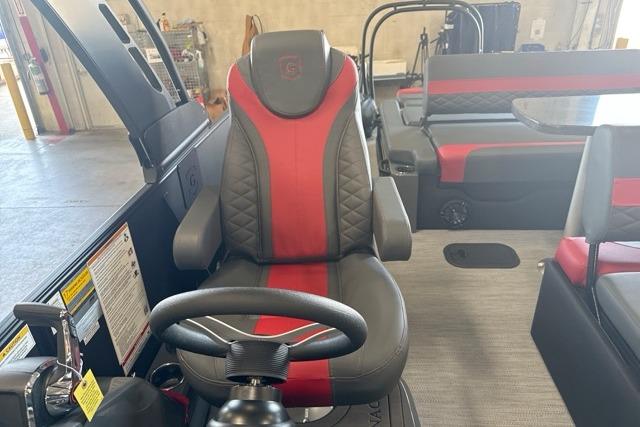 Luxurious interior of 2027 Godfrey Monaco 25' Tritoon with red and black seating.