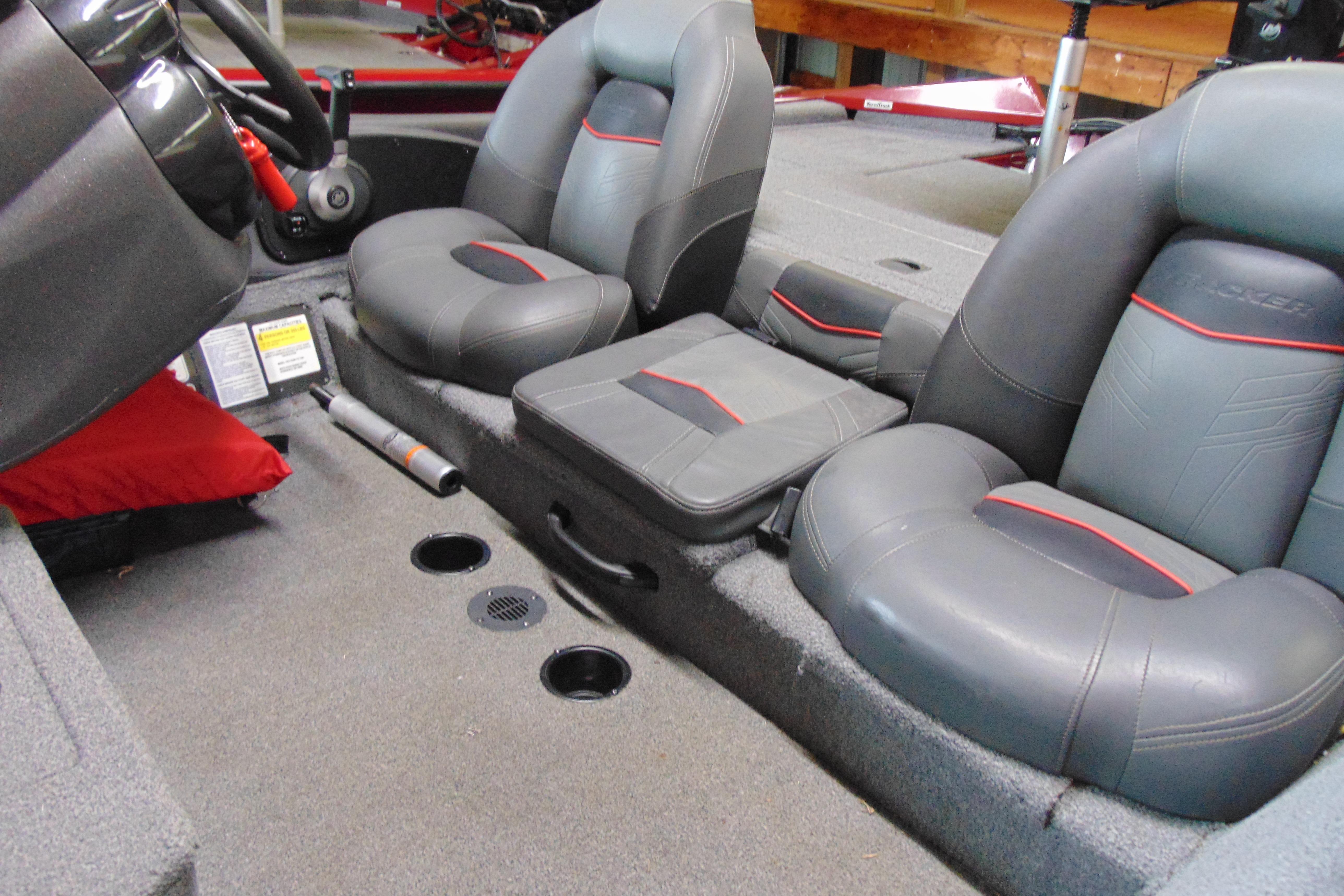 Interior of 2022 Bass Tracker Pro 17 boat with gray and red seating.