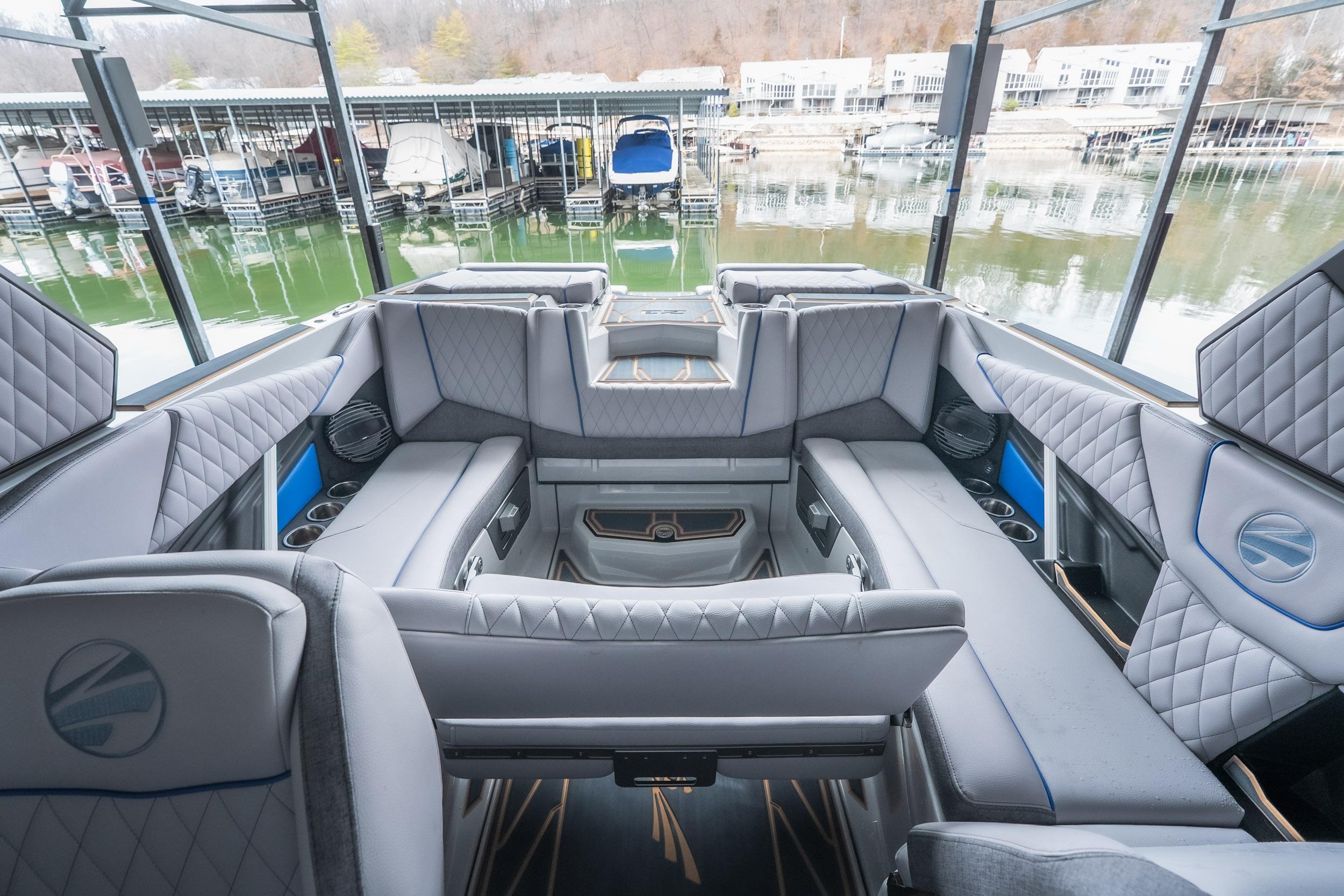 2026 Tigé Z3 boat interior with luxurious seating and modern design at a marina.